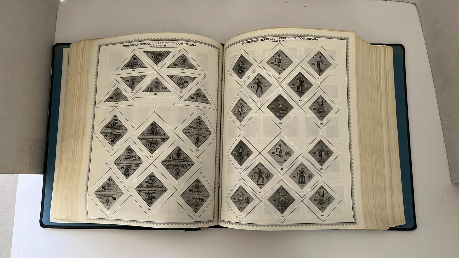 Photo 1 of GLOBAL STAMP ALBUM CONTAINING VINTAGE STAMPS