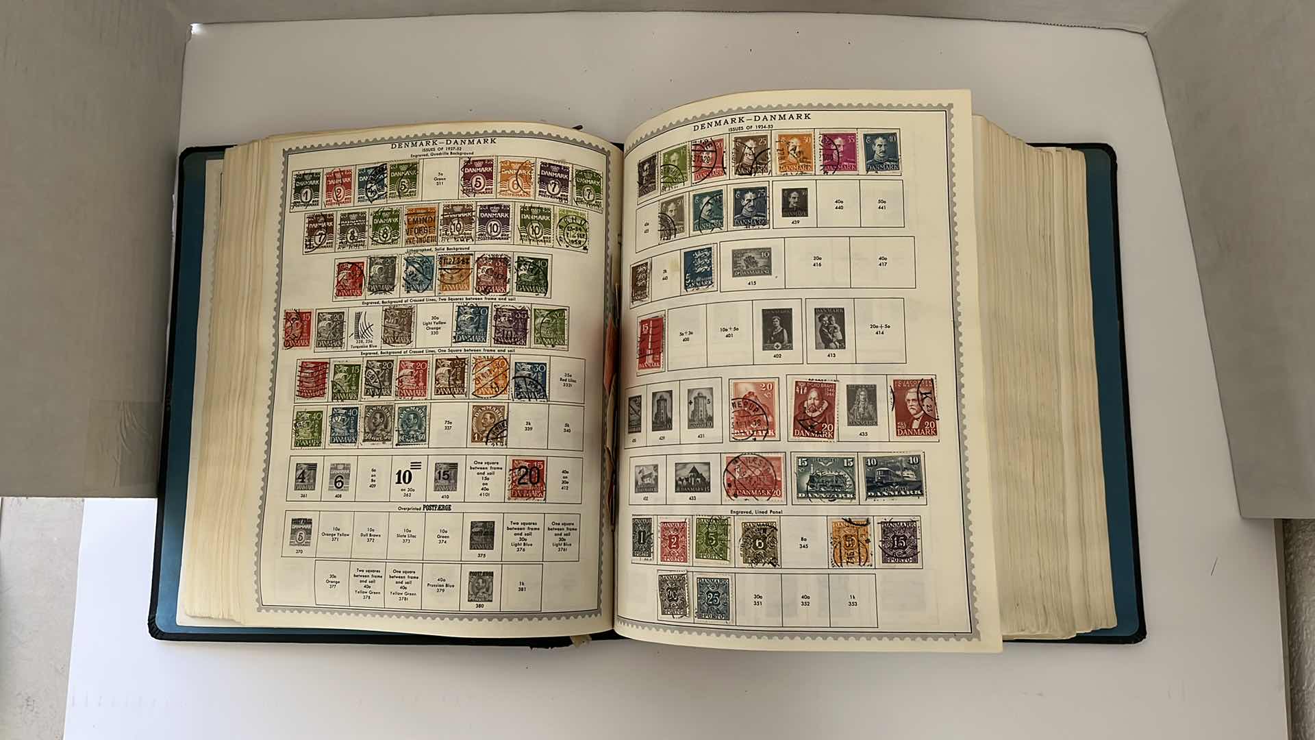 Photo 1 of GLOBAL STAMP ALBUM CONTAINING VINTAGE STAMPS