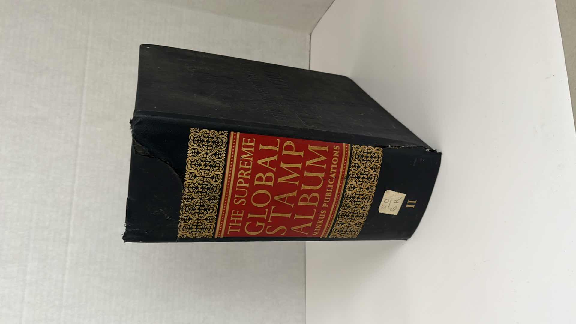 Photo 1 of GLOBAL STAMP ALBUM CONTAINING VINTAGE STAMPS