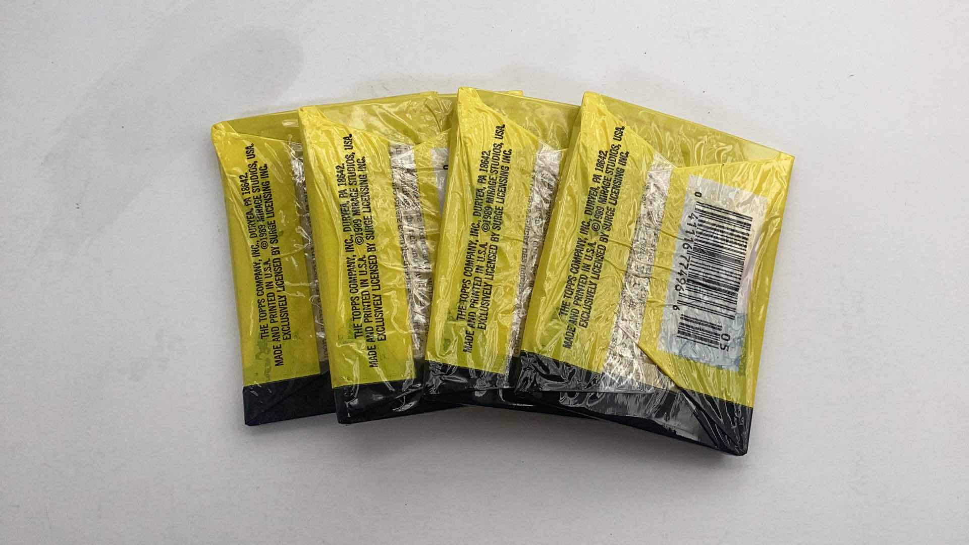 Photo 1 of SET OF 4 1989 TEENAGE MUTANT NINJA TURTLES CARD PACK