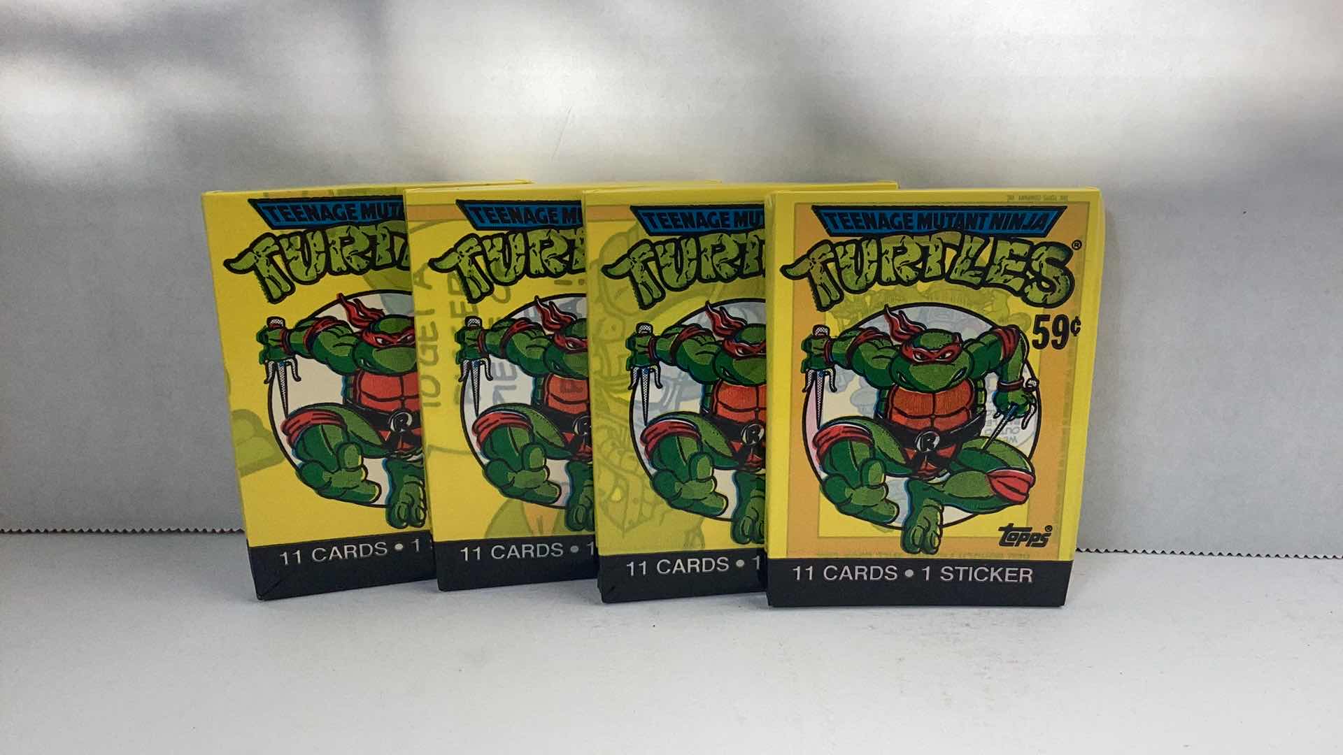 Photo 1 of SET OF 4 1989 TEENAGE MUTANT NINJA TURTLES CARD PACK