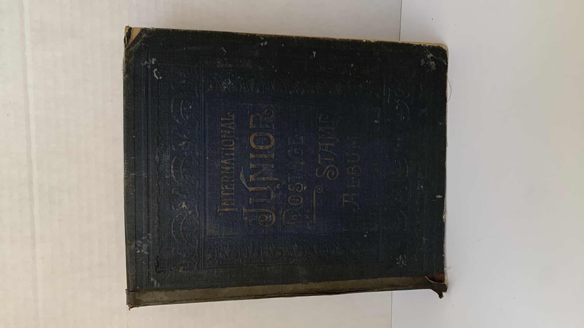 Photo 1 of INTERNATIONAL JUNIOR POSTAGE STAMP ALBUM