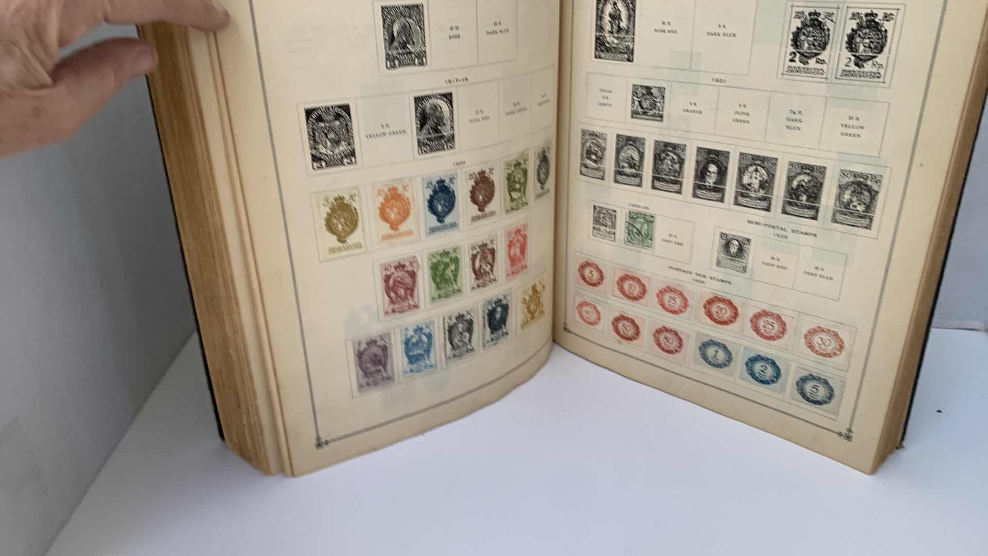 Photo 1 of INTERNATIONAL JUNIOR POSTAGE STAMP ALBUM