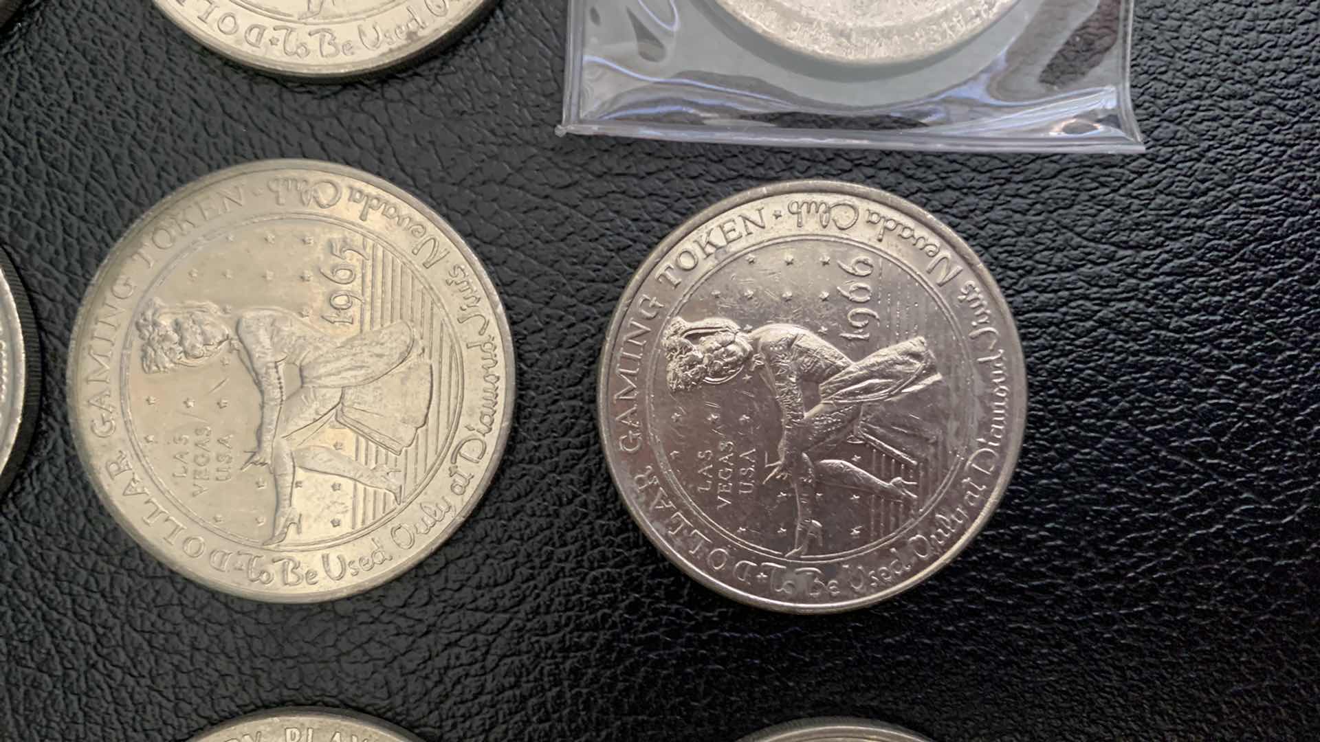 Photo 1 of 15- VINTAGE GAMING TOKENS - 13- ONE DOLLAR 1967 DIAMOND JOMS, 2 WHISKEY PETES