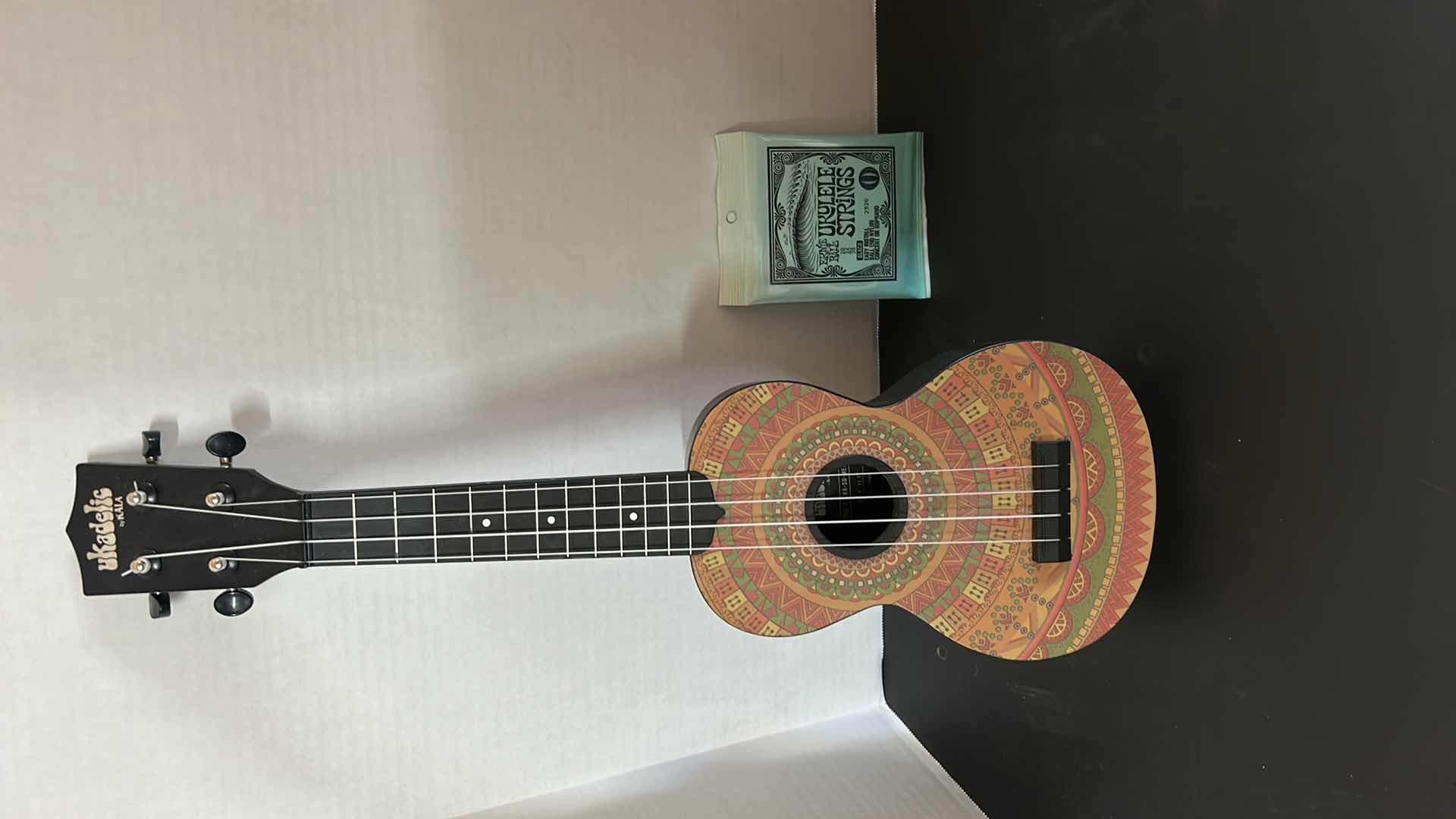 Photo 1 of UKELE AND NEW STRINGS