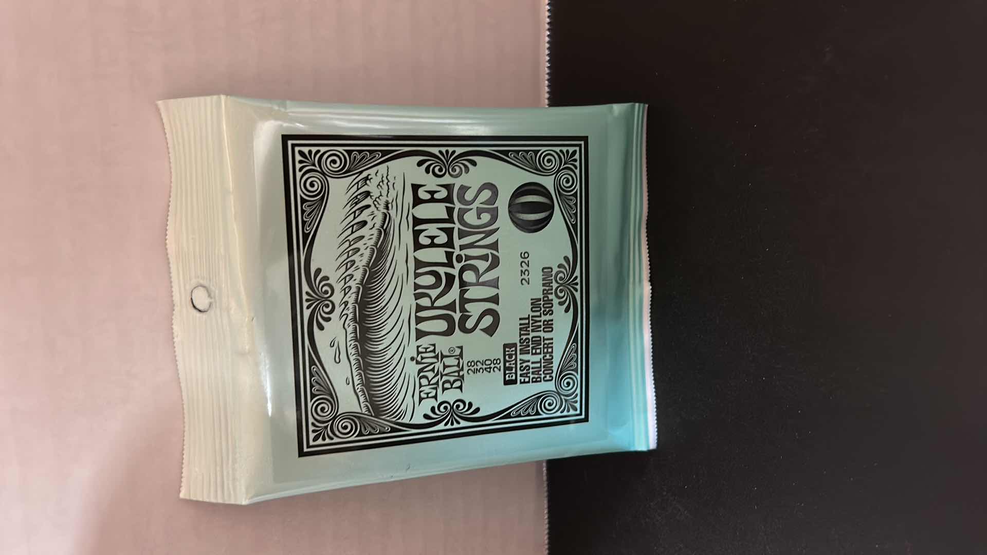 Photo 1 of UKELE AND NEW STRINGS