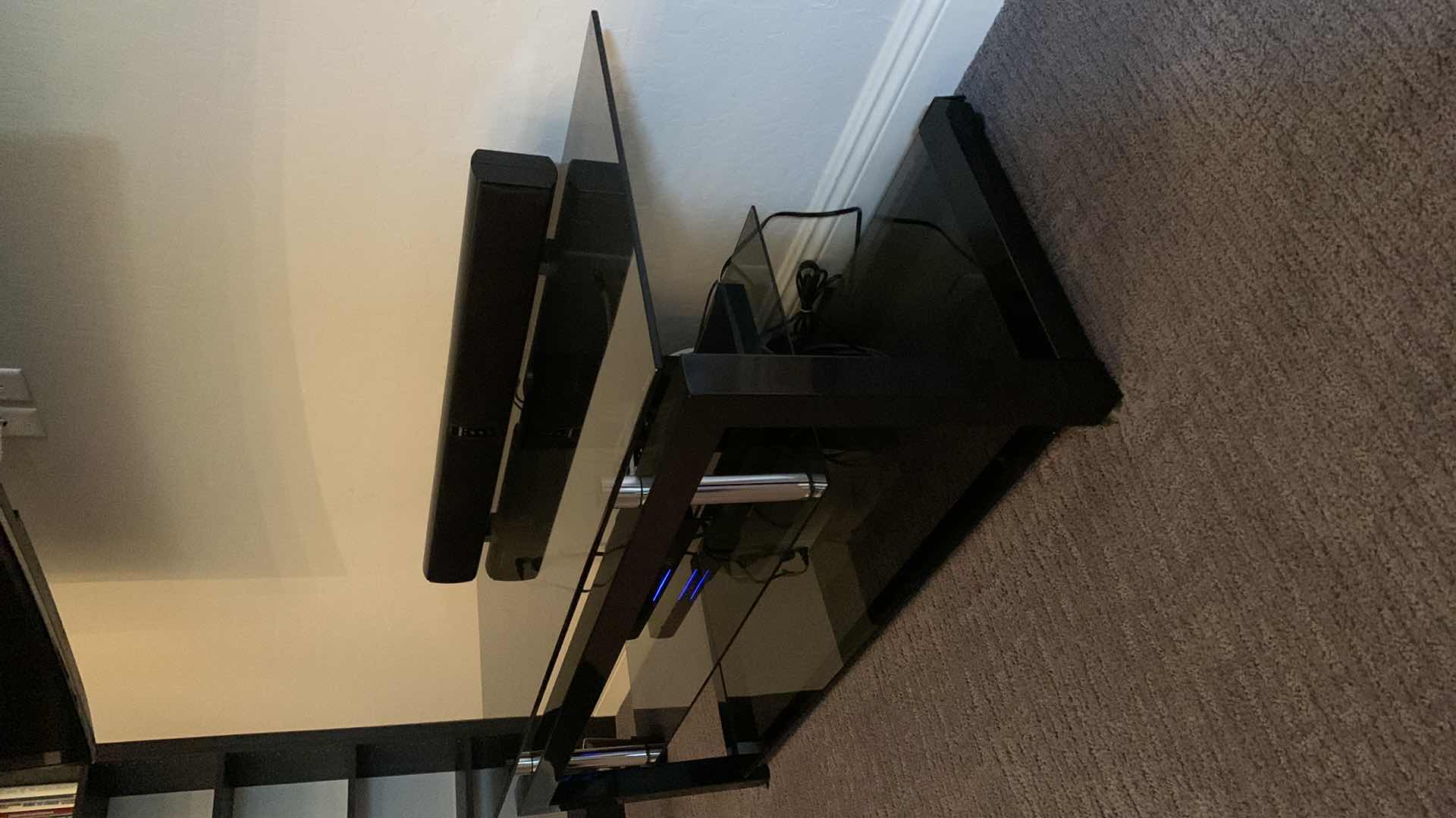 Photo 1 of BLACK TEMPERED SMOKED GLASS W CHROME ENTERTAINMENT CONSOLE (ELECTRONICS OR SOUNDBAR NOT INCLUDED) 52” x 20” x H20”