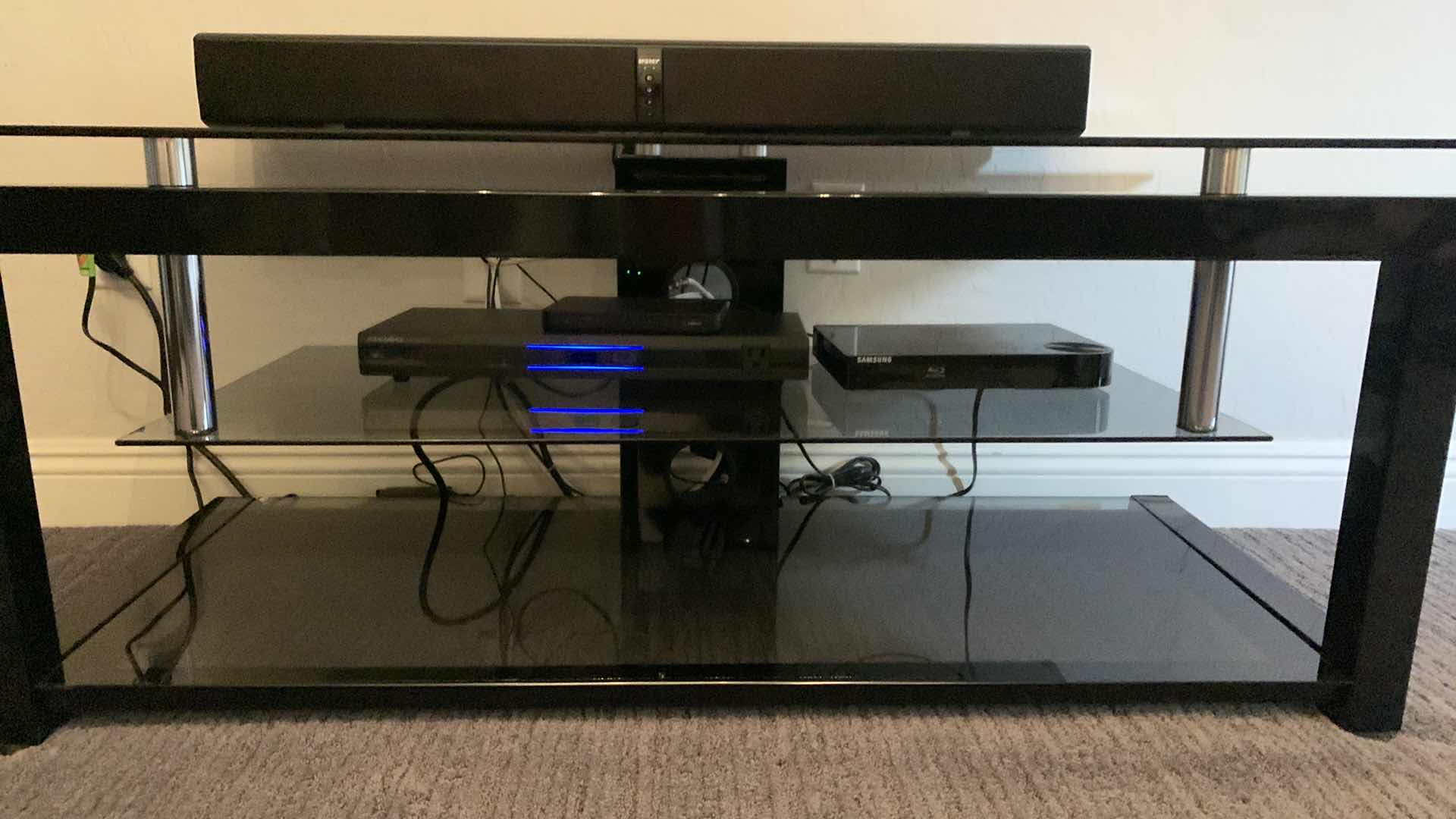 Photo 1 of BLACK TEMPERED SMOKED GLASS W CHROME ENTERTAINMENT CONSOLE (ELECTRONICS OR SOUNDBAR NOT INCLUDED) 52” x 20” x H20”