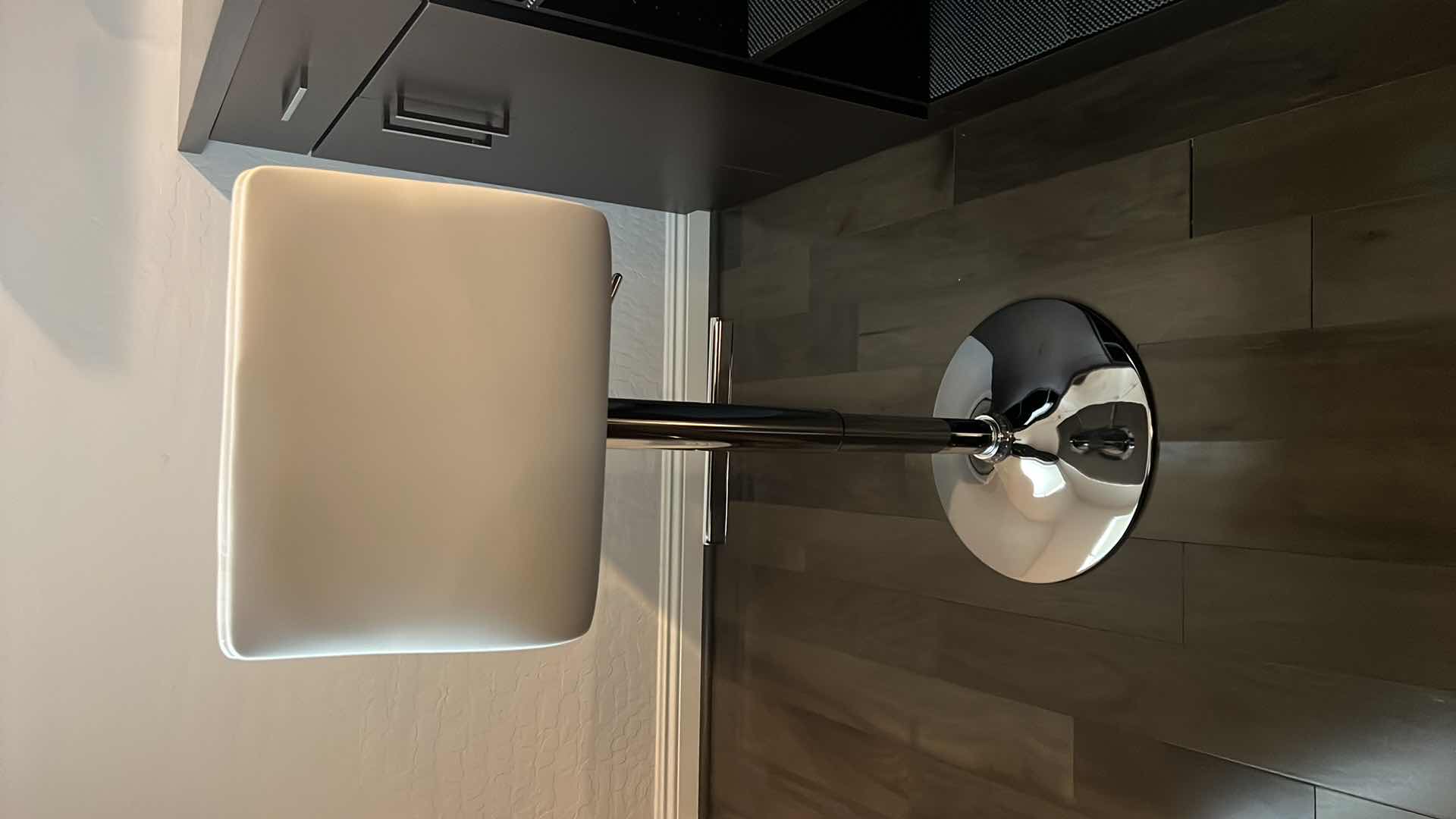 Photo 1 of DESIGNER WHITE LEATHER ADJUSTABLE ARMLESS SWIVEL UP AMD DOWN BAR STOOL W SILVER BASE