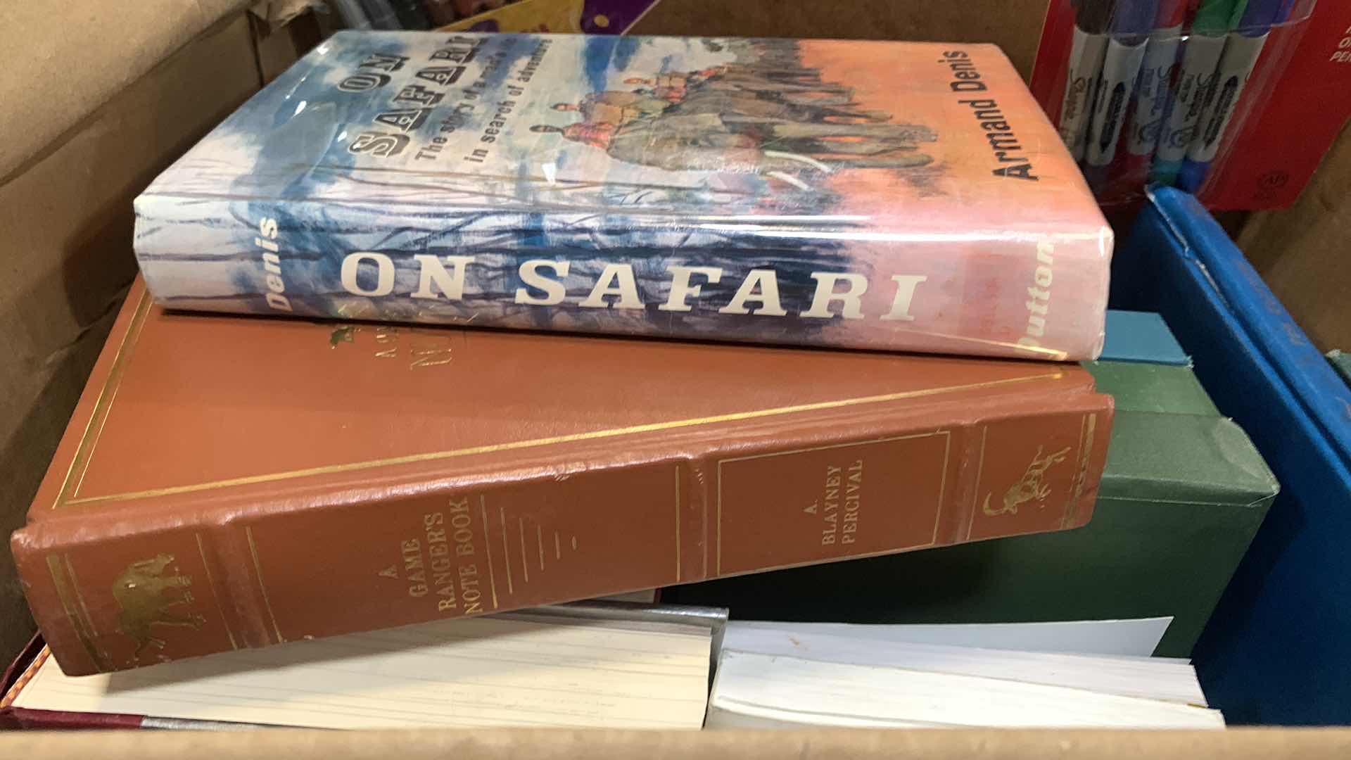 Photo 1 of BOX OF BOOKS W MARKERS