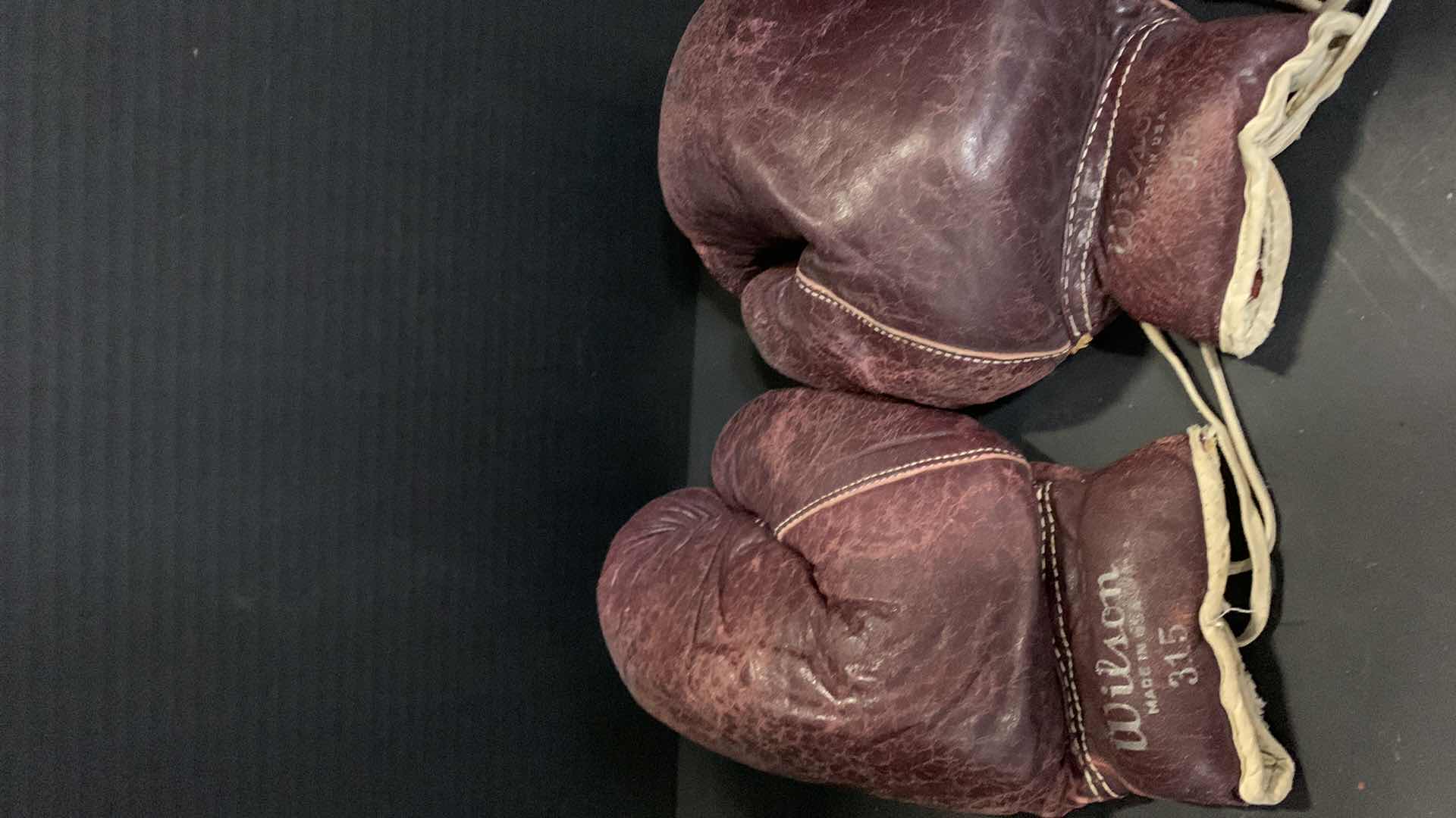 Photo 1 of VINTAGE LEATHER BOXING GLOVES, METAL ROLLER SKATES