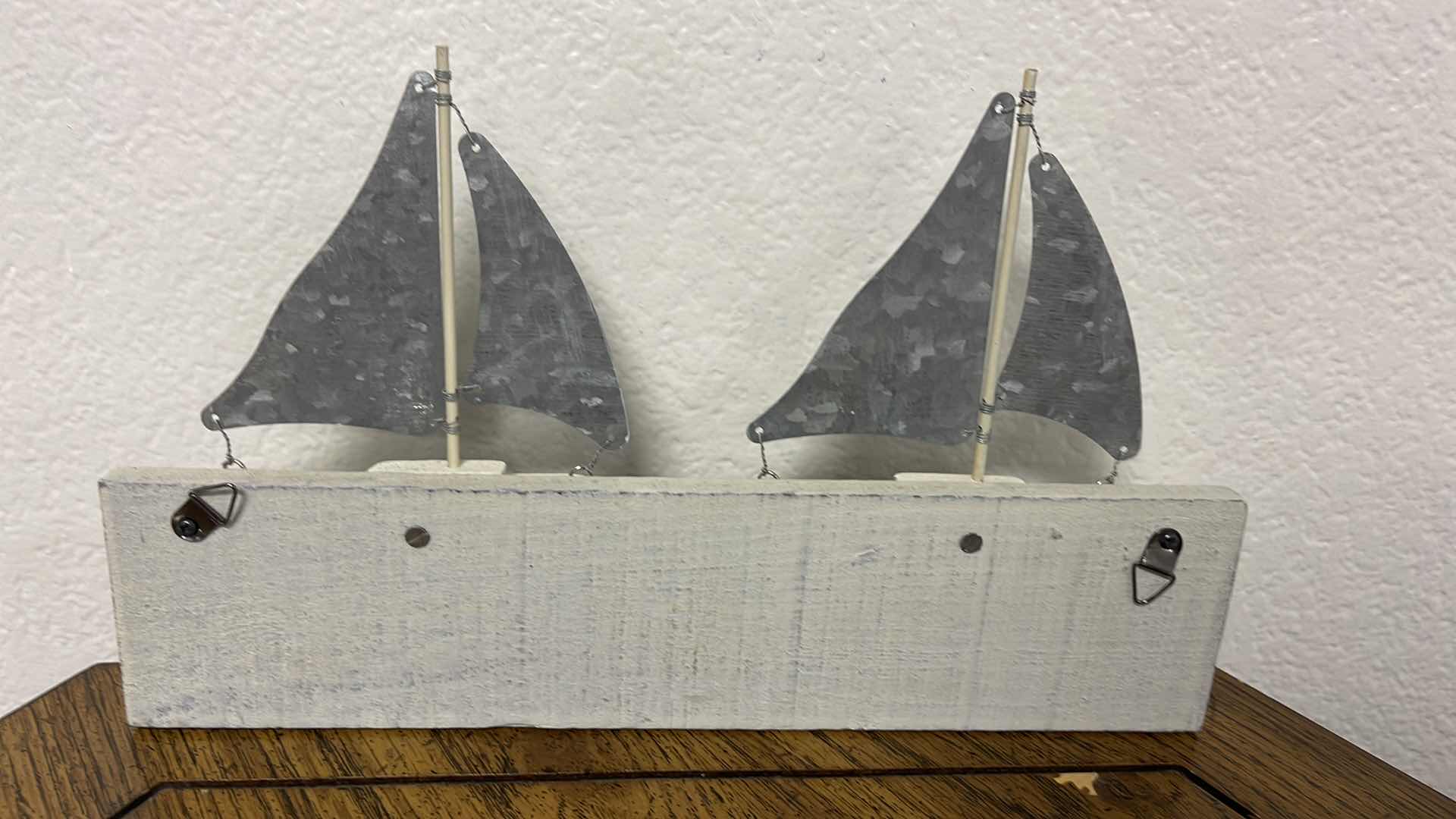 Photo 1 of WOOD BASE COAT HANGER W MEDAL SAILS 12” X 7”