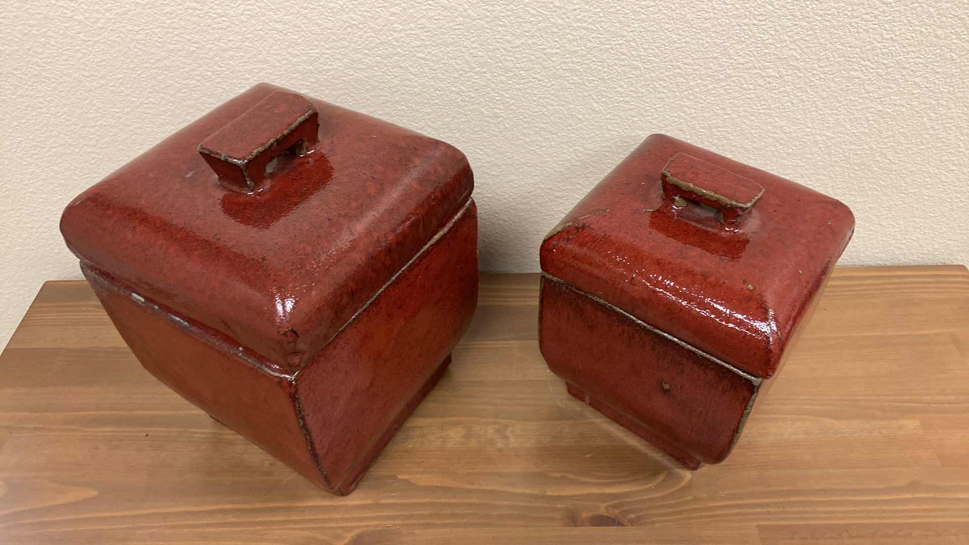 Photo 1 of PAIR OF GLAZED RED POTTERY CANNISTERS LARGEST 8” X 12”