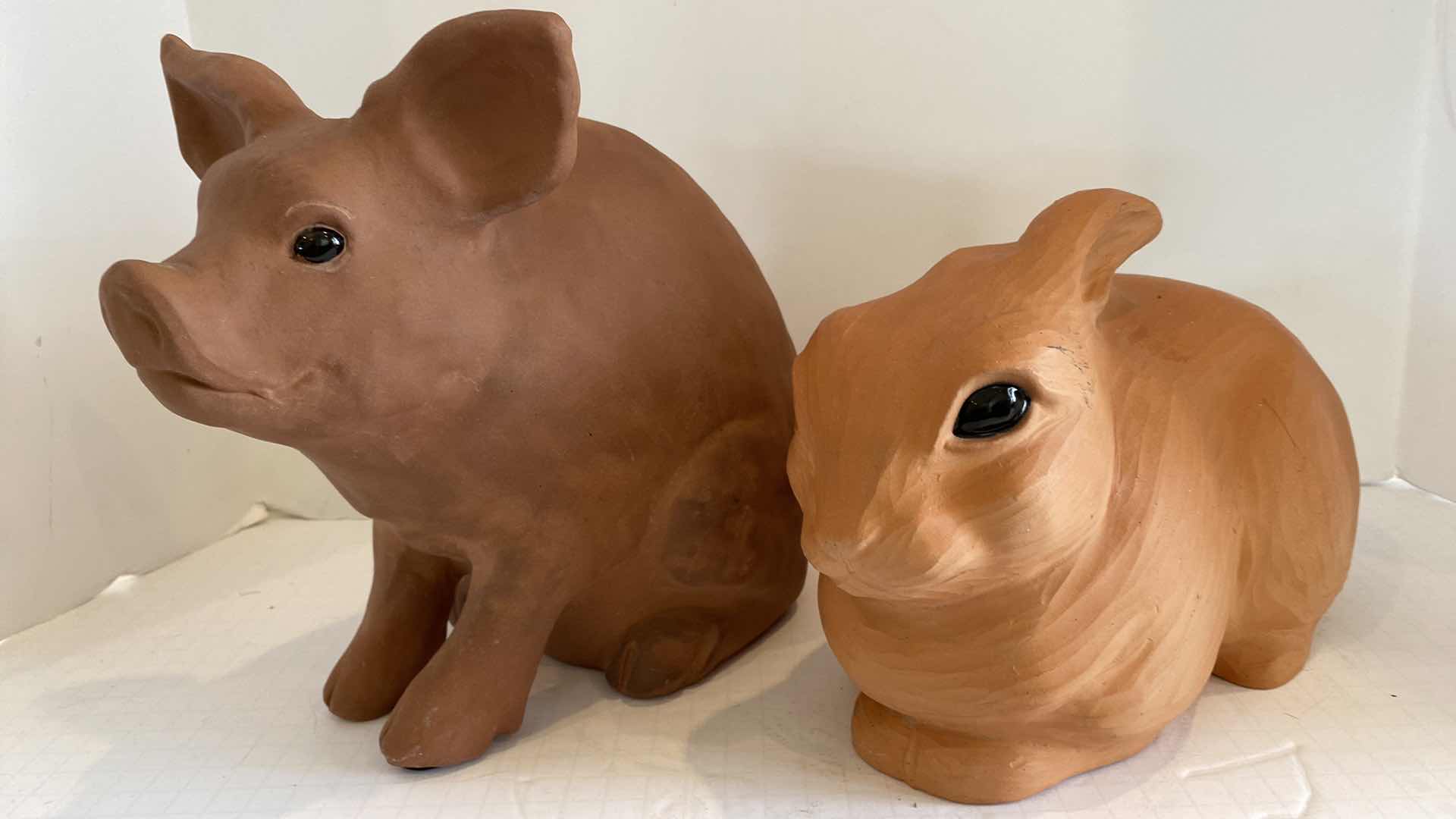 Photo 1 of PAIR OF CLAY POTTERY ANIMALS LARGEST 11” X 9”
