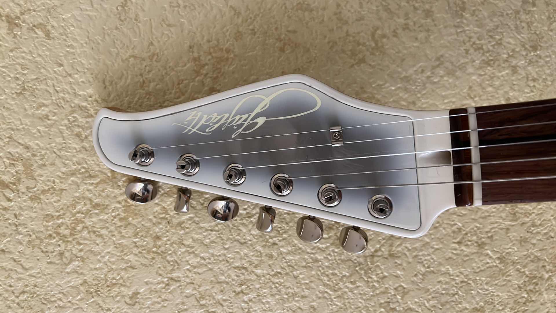Photo 1 of GIGLIOTTI SIGNED PEARL WHITE ELECTRIC GUITAR W COA