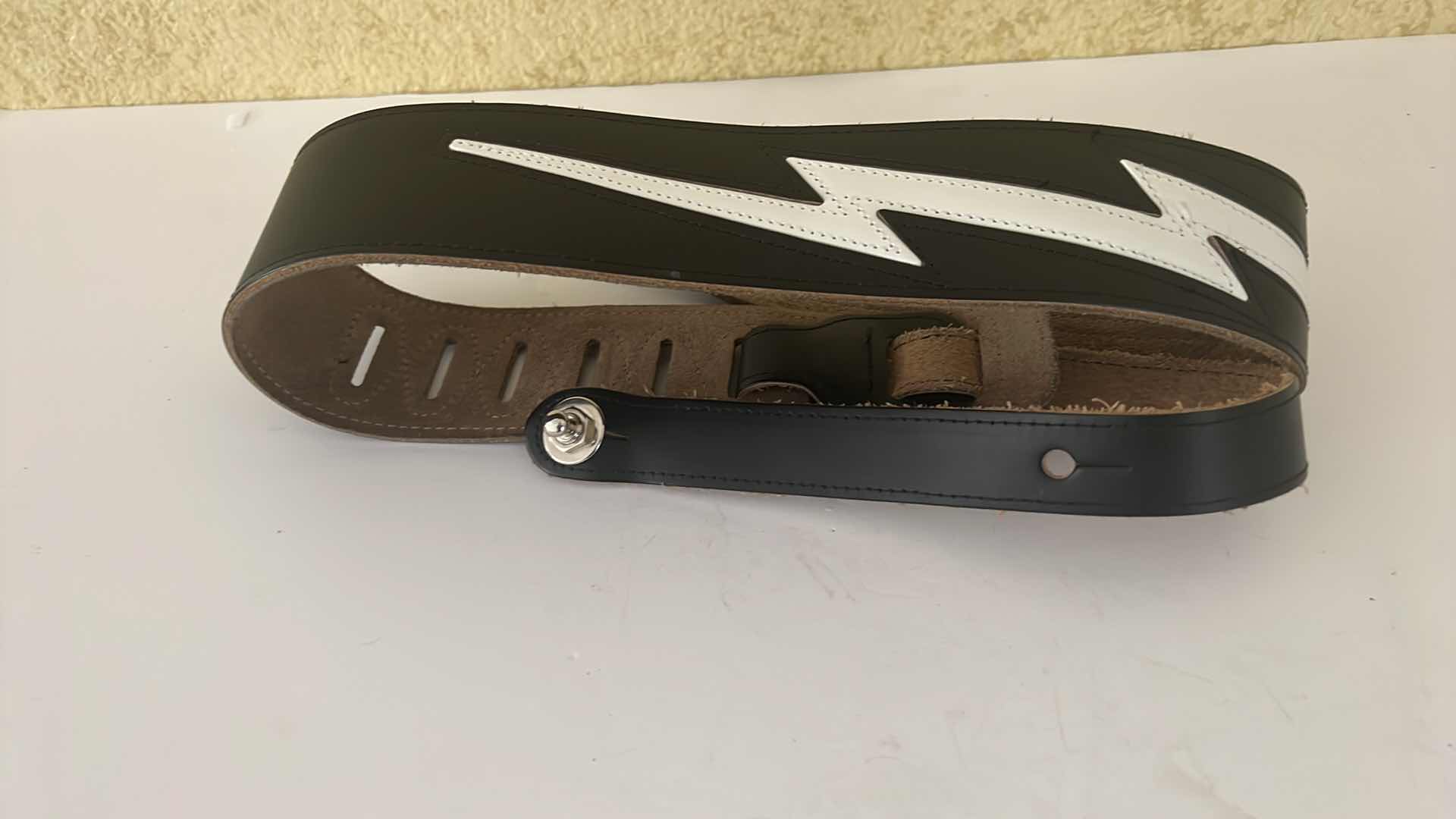 Photo 1 of BLACK LEATHER W WHITE LIGHTENING BOLT MADE IN GERMANY GUITAR STRAP