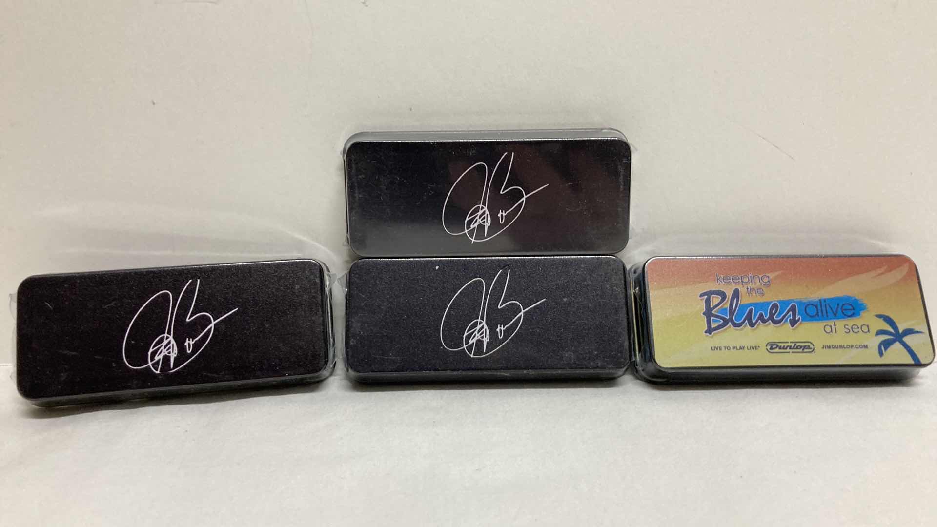 Photo 1 of NEW JOE BONAMASSA PICK TINS W PICKS (4) 1.5” X 3.5” H0.5”