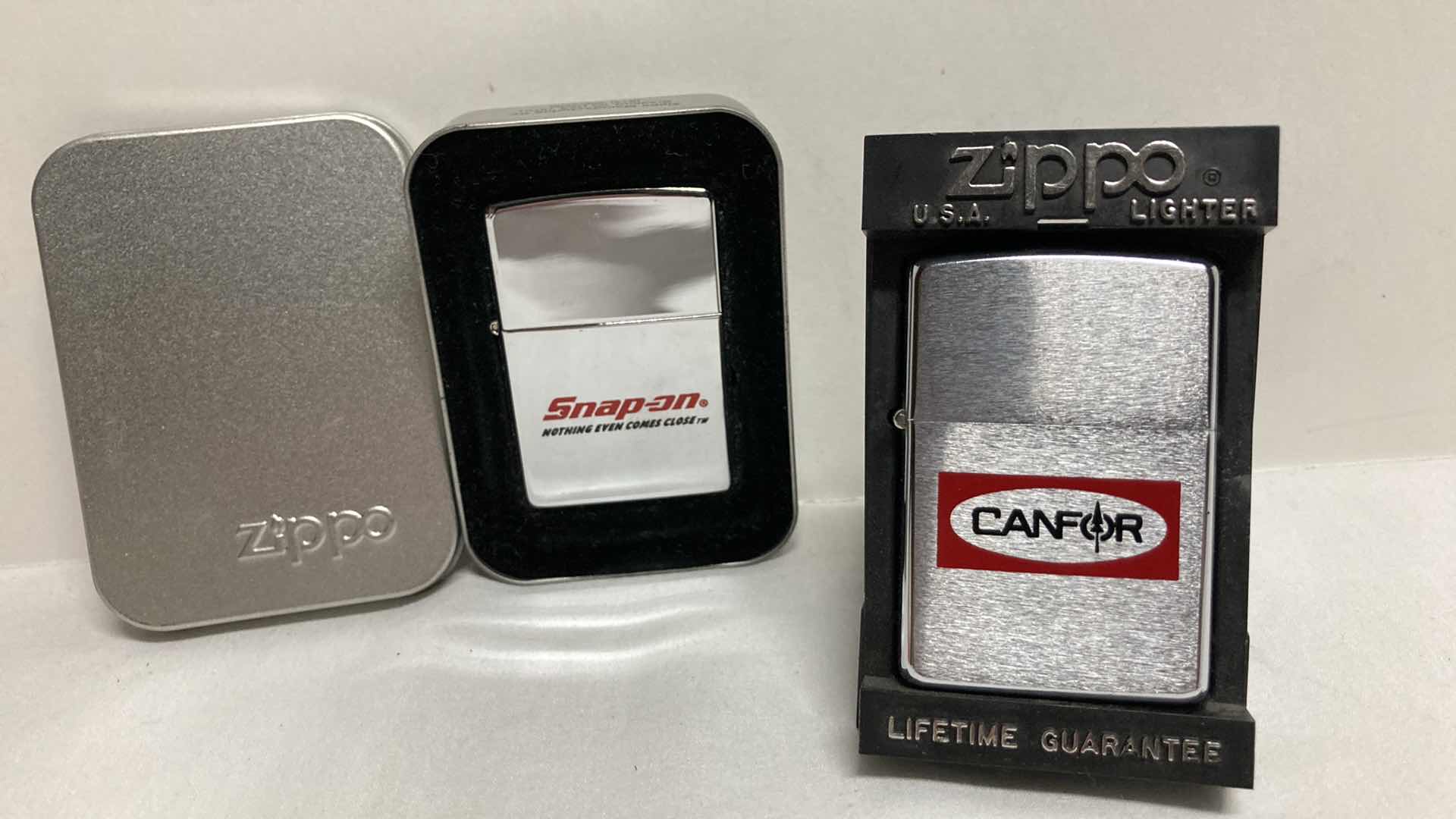 Photo 1 of ZIPPO SNAP ON LIGHTER & ZIPPO CANFOR LIGHTER W CASES