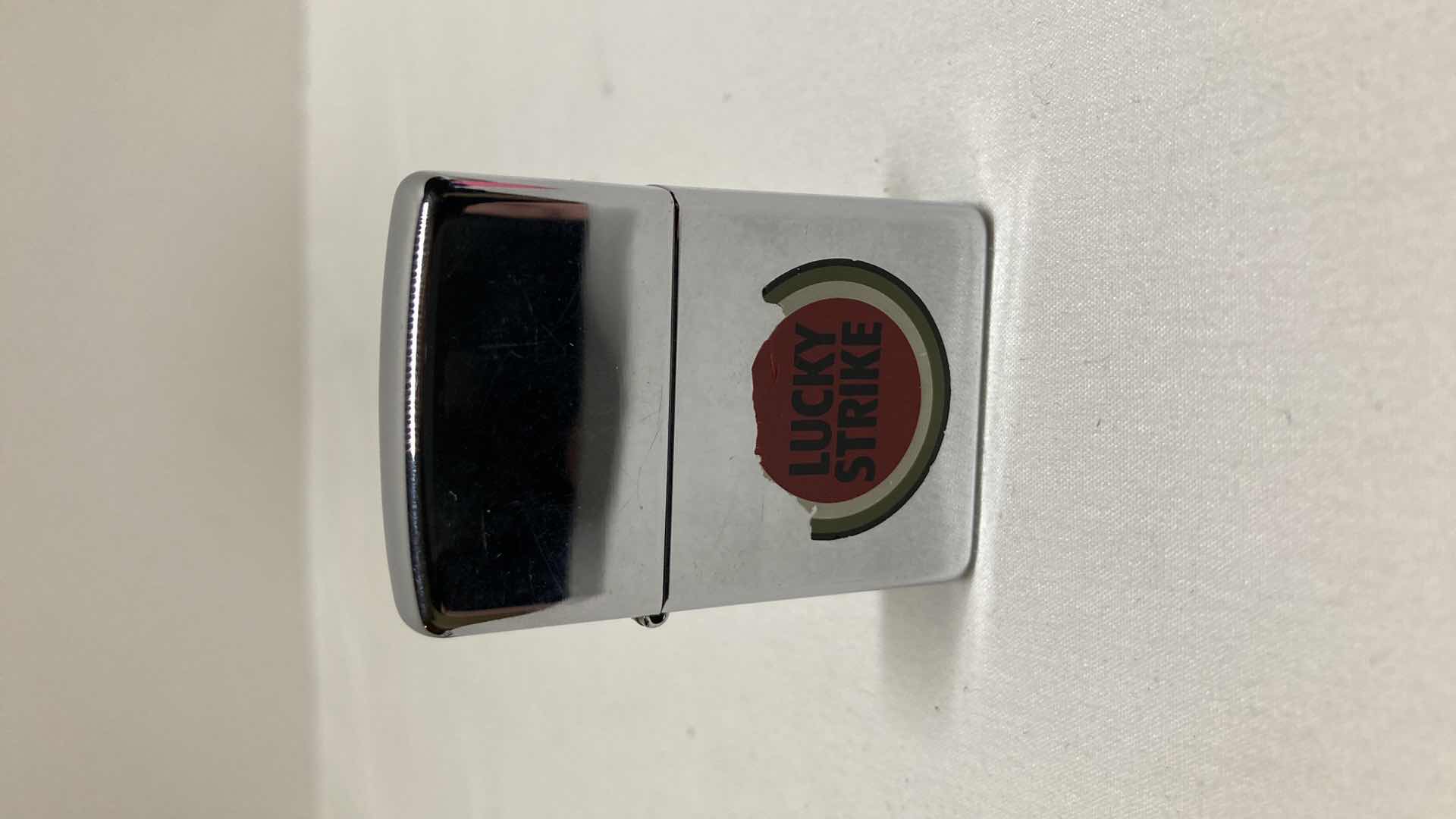 Photo 1 of VINTAGE ZIPPO LUCKY STRIKE LIGHTER W CASE & ZIPPO LUCKY STRIKE LIGHTER