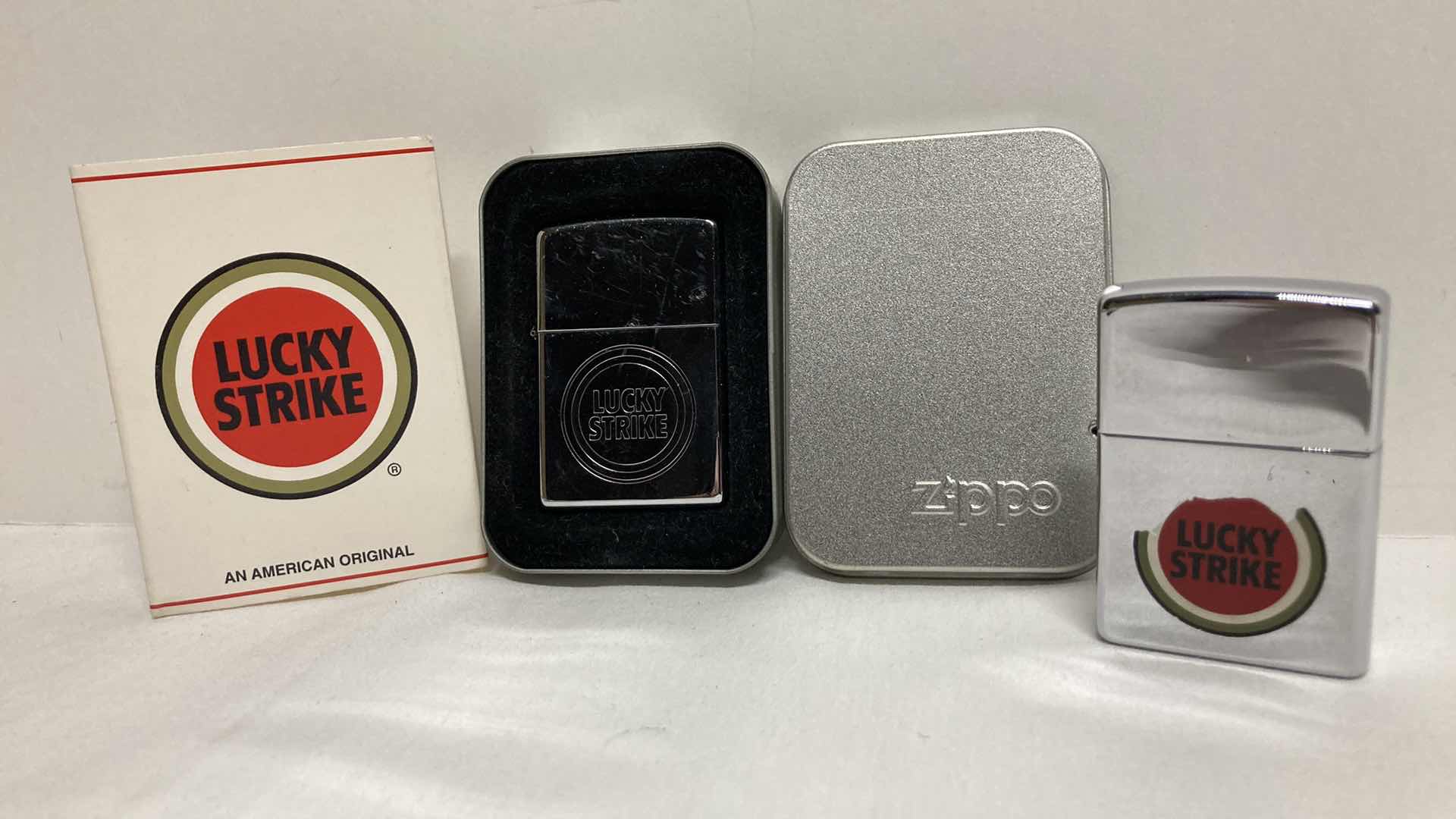 Photo 1 of VINTAGE ZIPPO LUCKY STRIKE LIGHTER W CASE & ZIPPO LUCKY STRIKE LIGHTER