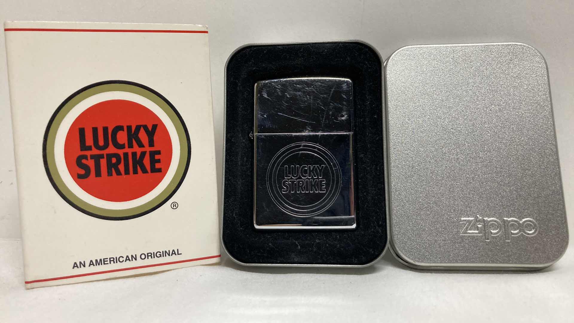 Photo 1 of VINTAGE ZIPPO LUCKY STRIKE LIGHTER W CASE & ZIPPO LUCKY STRIKE LIGHTER