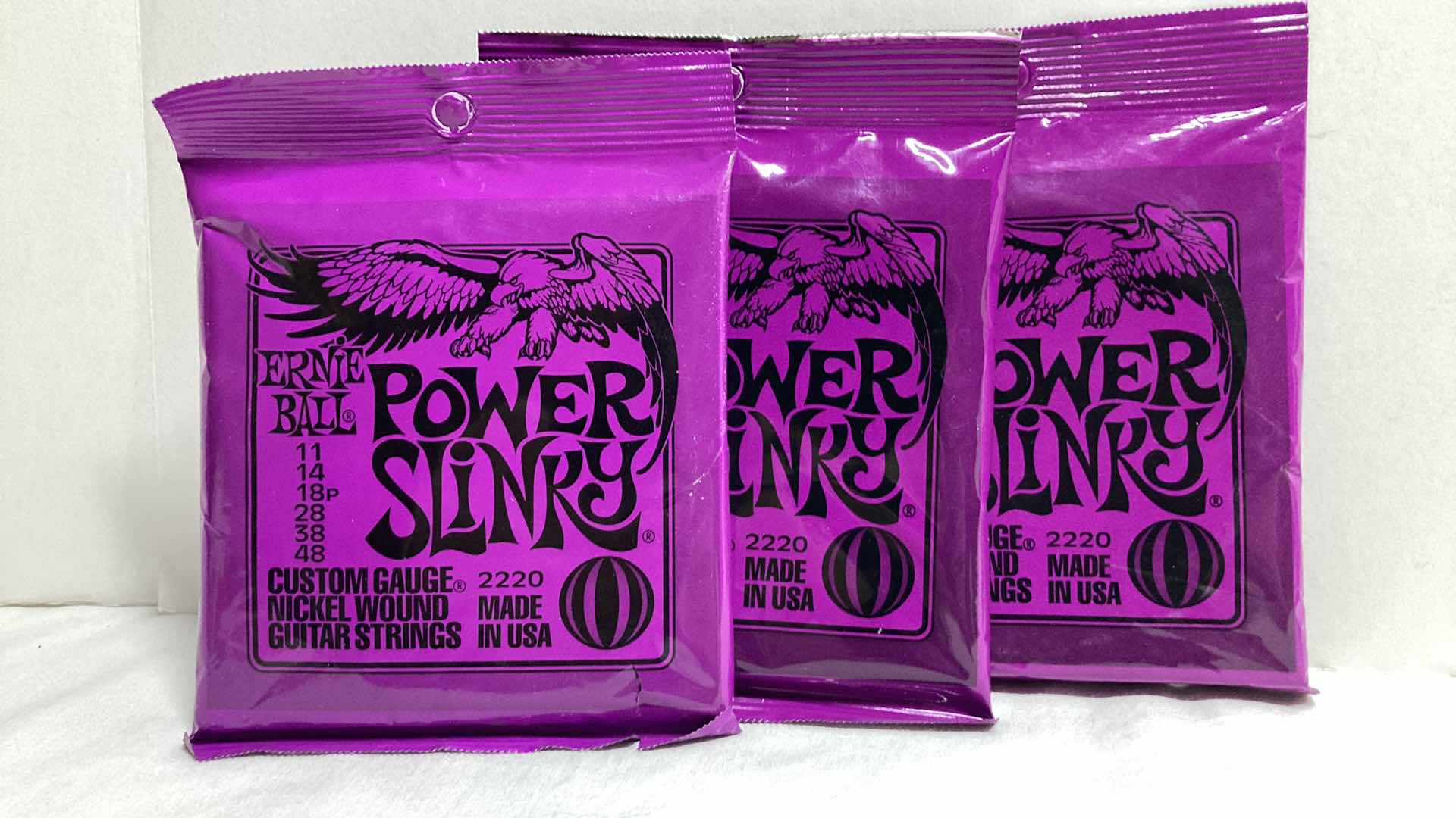 Photo 1 of NEW ERNIE BALL CUSTOM GAUGE NICKEL WOUND GUITAR STRINGS MULTI PACK (12)