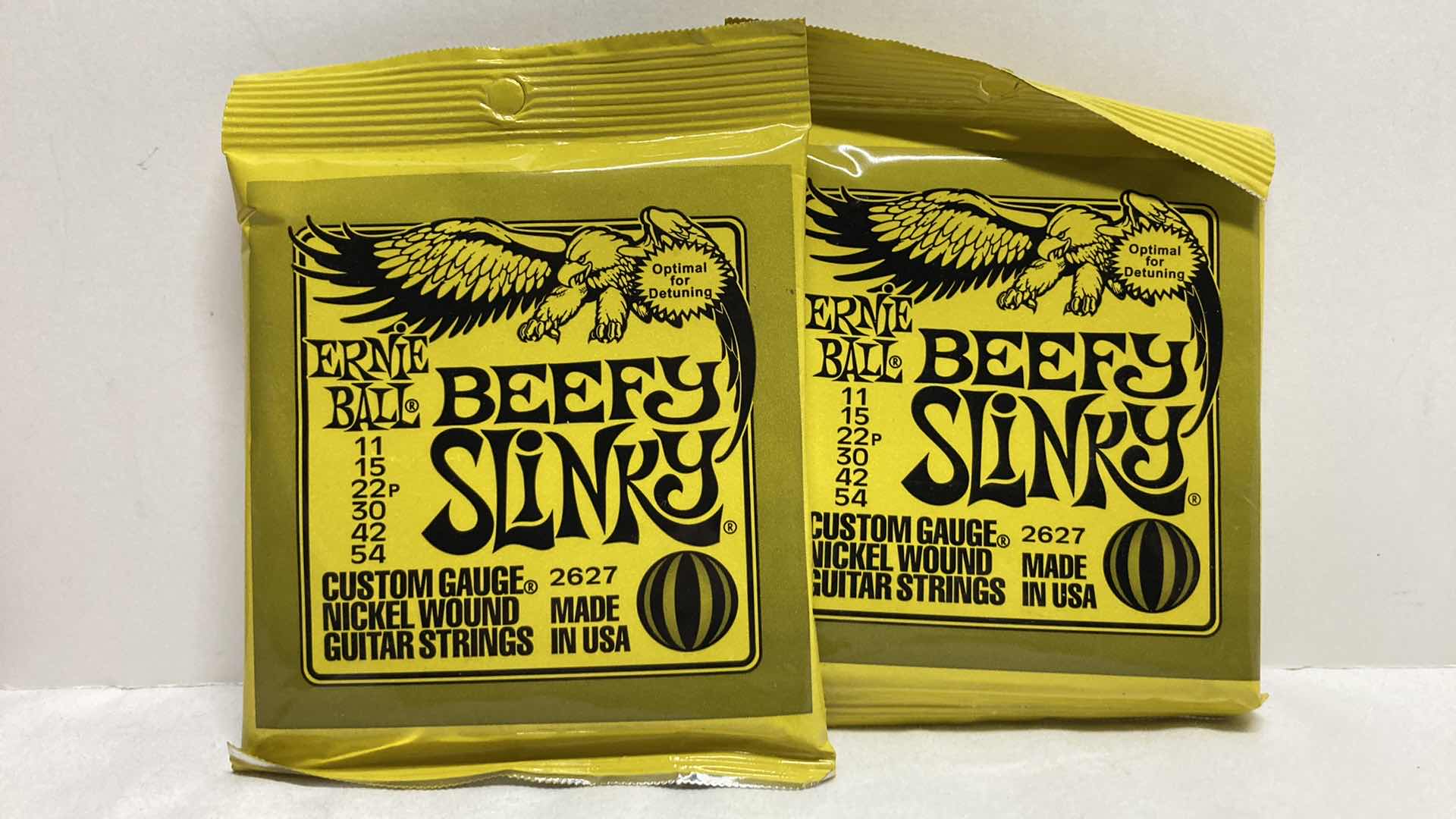 Photo 1 of NEW ERNIE BALL CUSTOM GAUGE NICKEL WOUND GUITAR STRINGS MULTI PACK (12)