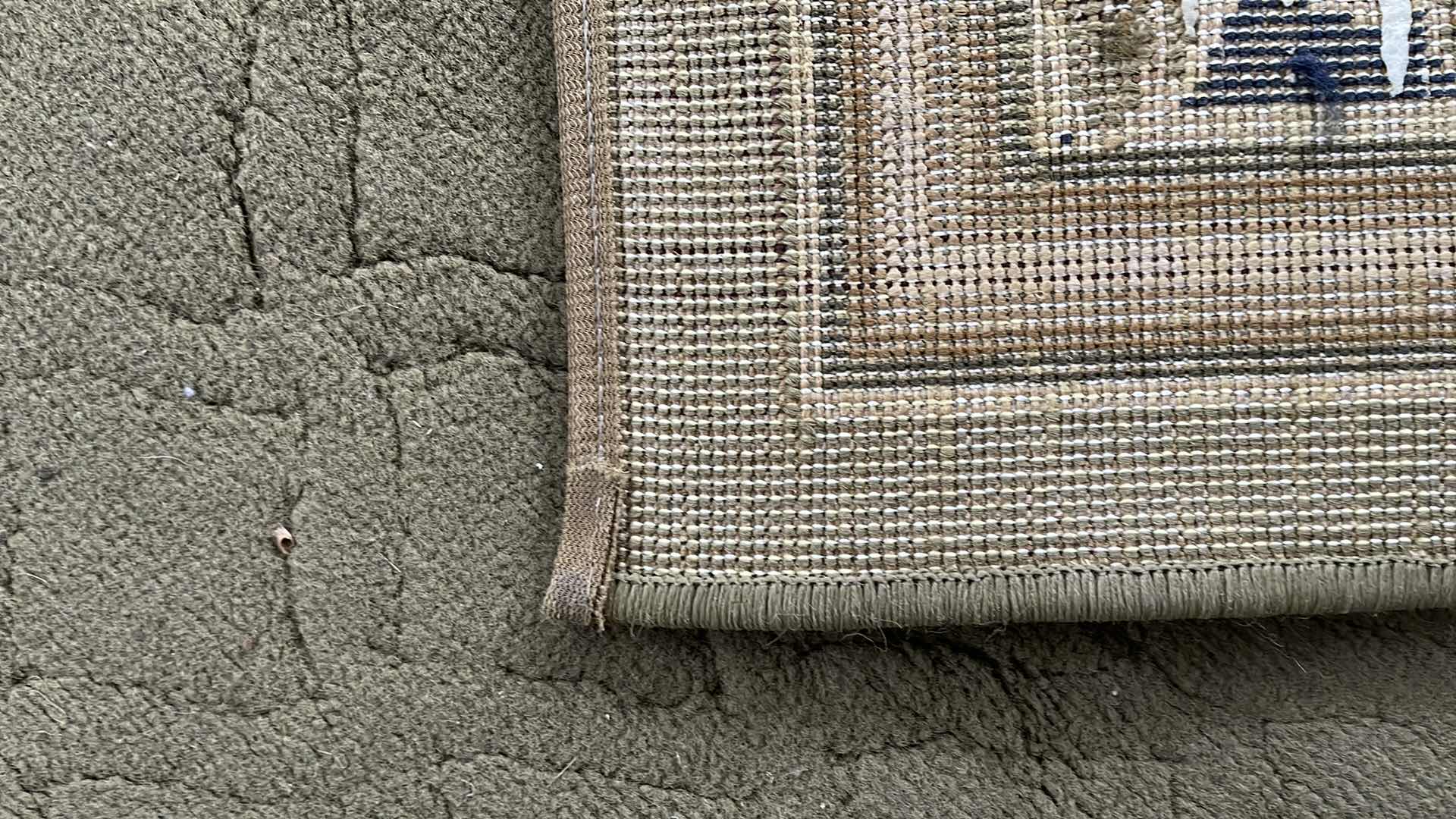 Photo 1 of FLORAL EDGE AREA RUG 62x90 
NEEDS TO BE CLEANED