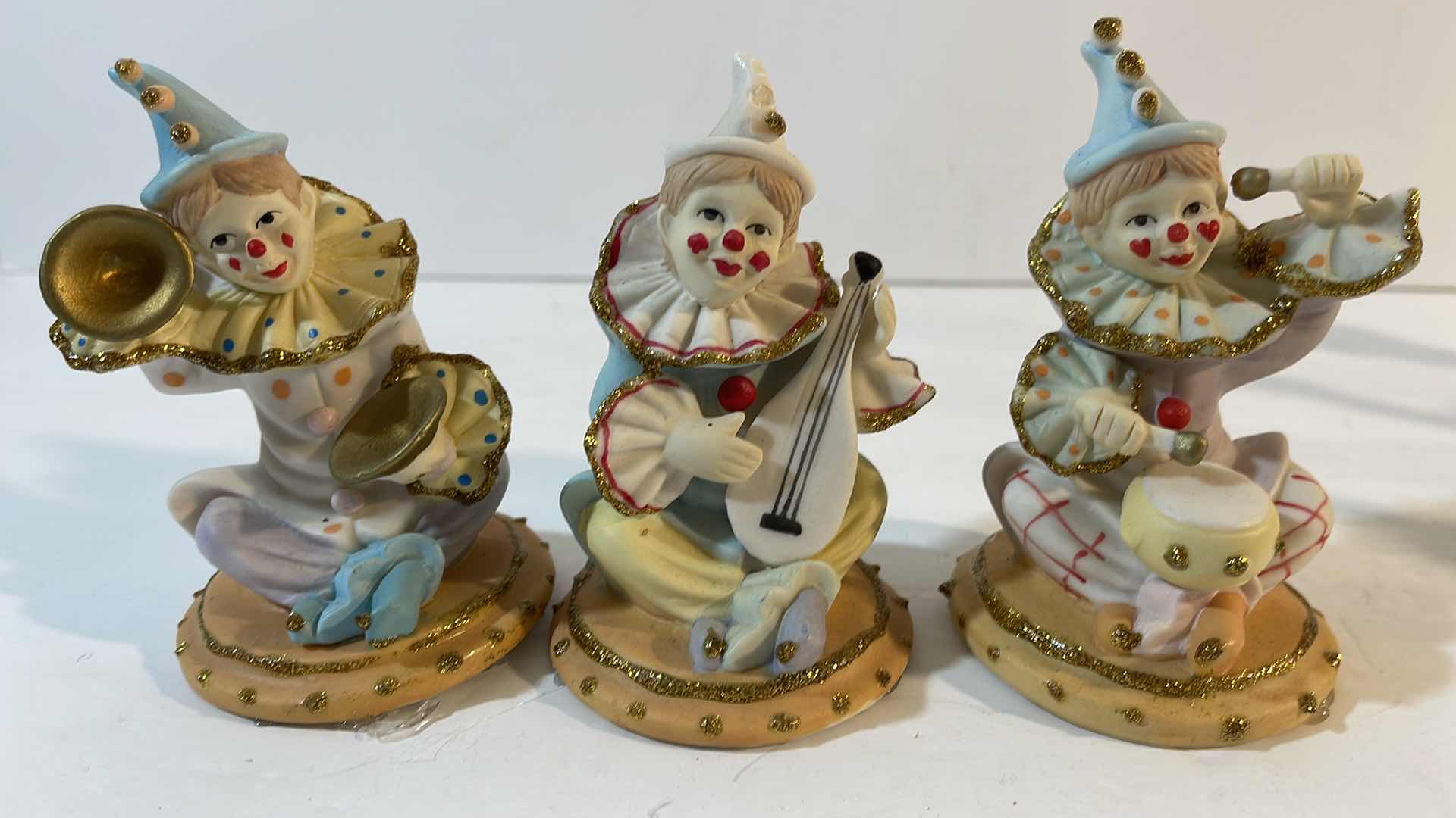 Photo 1 of CLOWN COLLECTION PORCELAIN FIGURINES H-5”