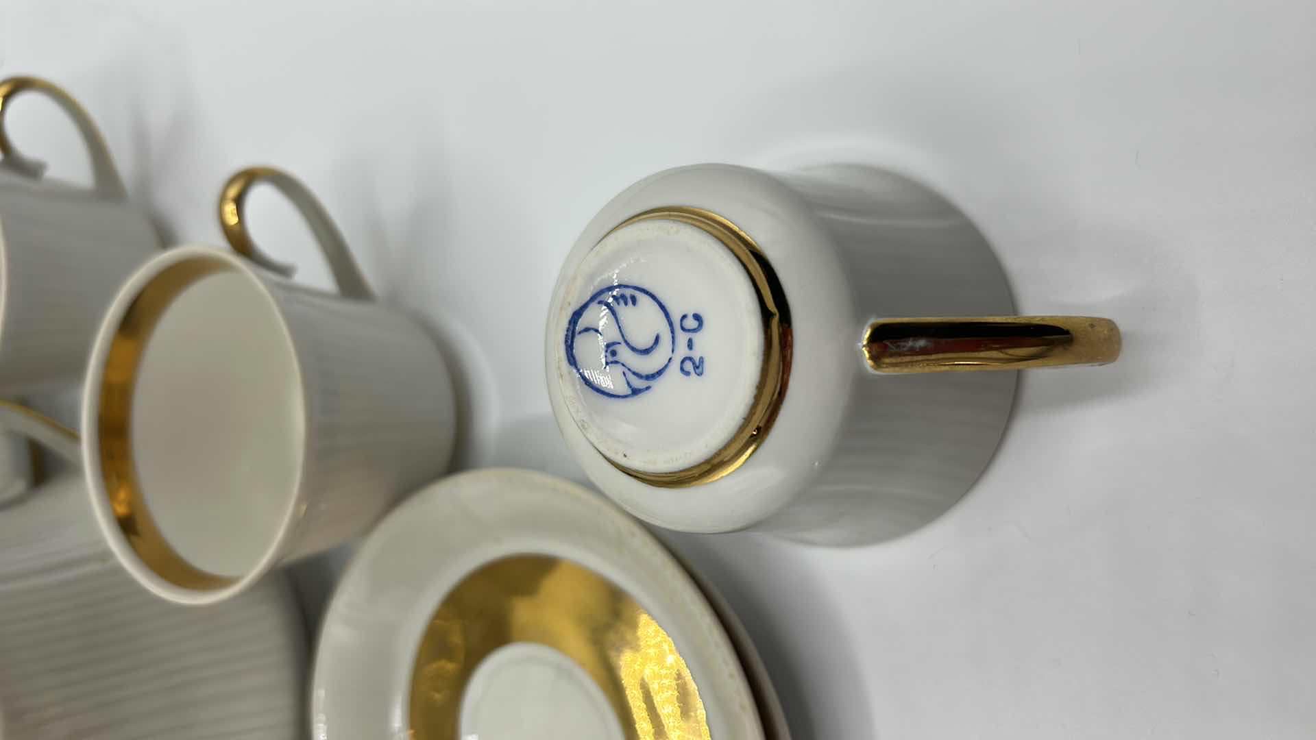 Photo 1 of VINTAGE 23 PIECE WHITE AND GOLD TRIMMED PORCELAIN EXPRESSO/TEA SET SIGNED W