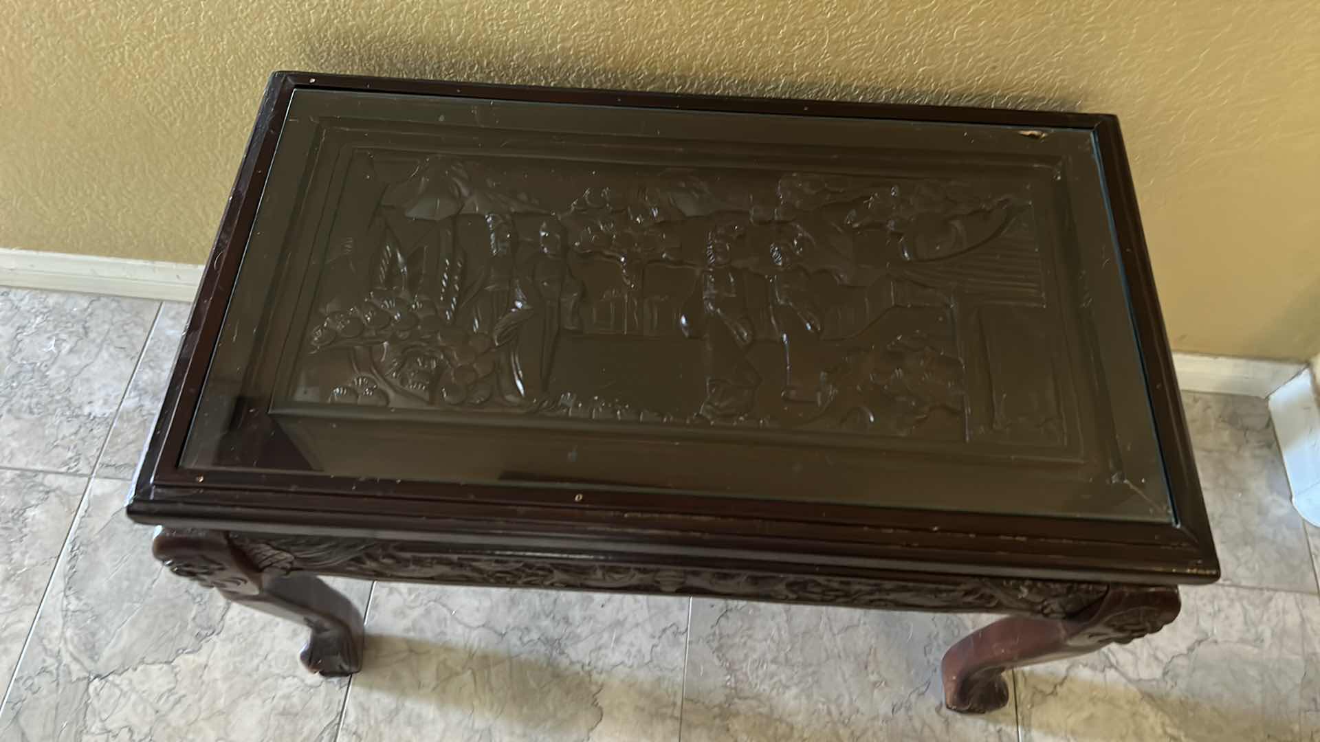 Photo 1 of CARVED WOOD TABLE WITH GLASS TOP, 24” x 13” H16.5”