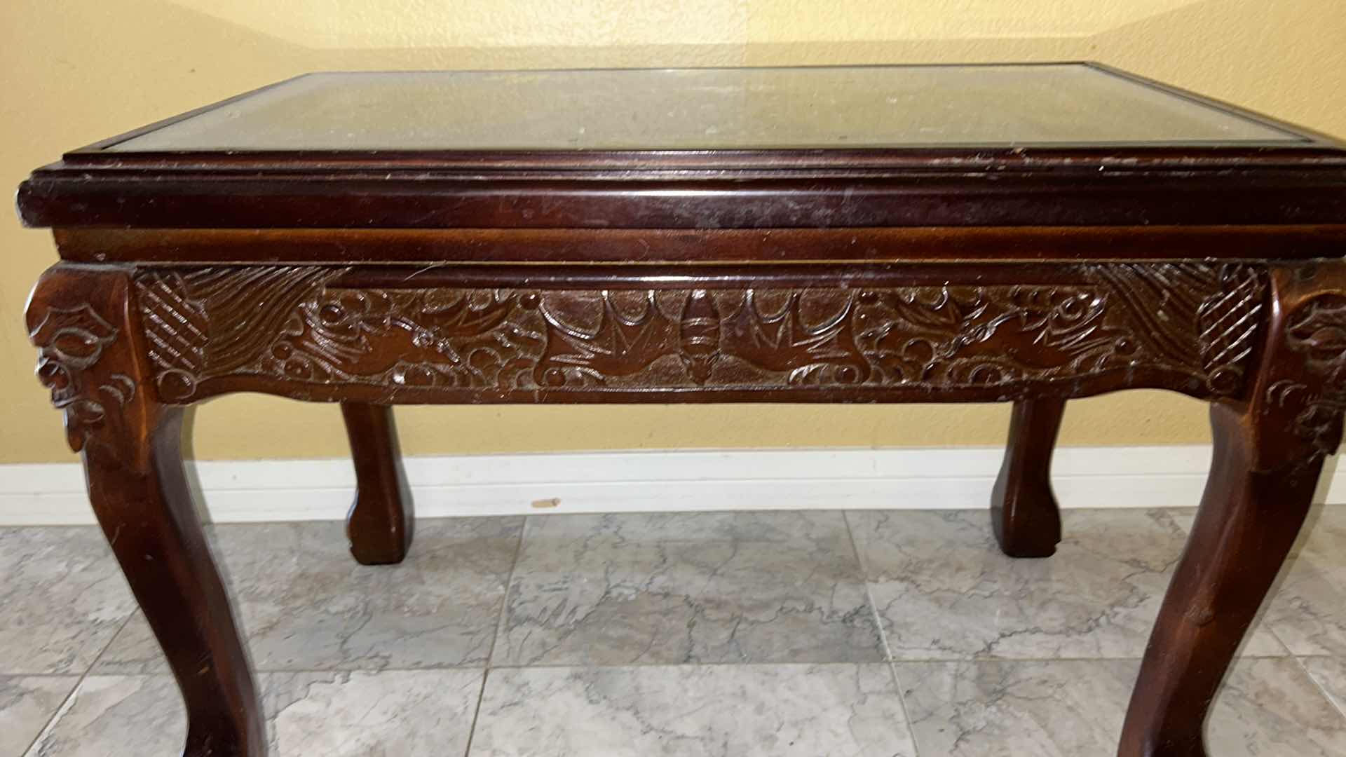 Photo 1 of CARVED WOOD TABLE WITH GLASS TOP, 24” x 13” H16.5”