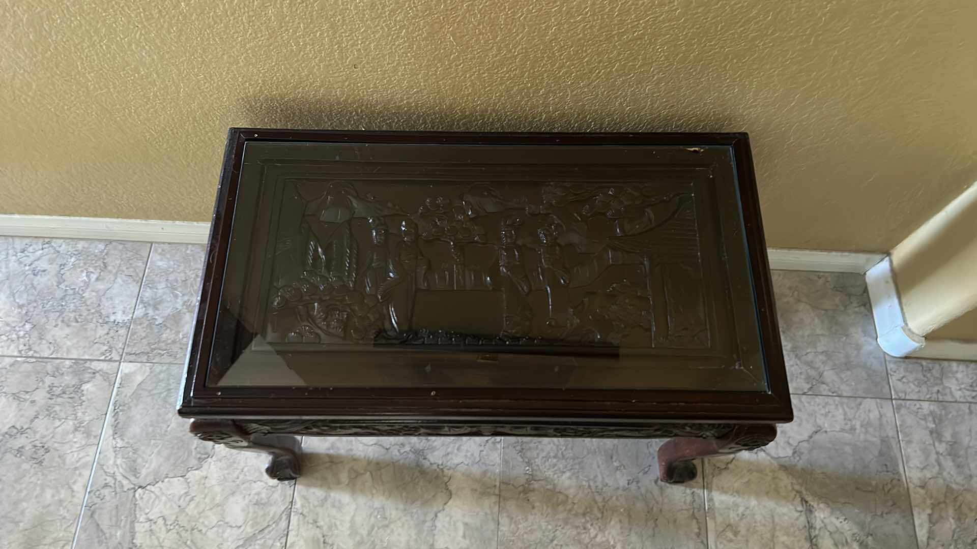 Photo 1 of CARVED WOOD TABLE WITH GLASS TOP, 24” x 13” H16.5”