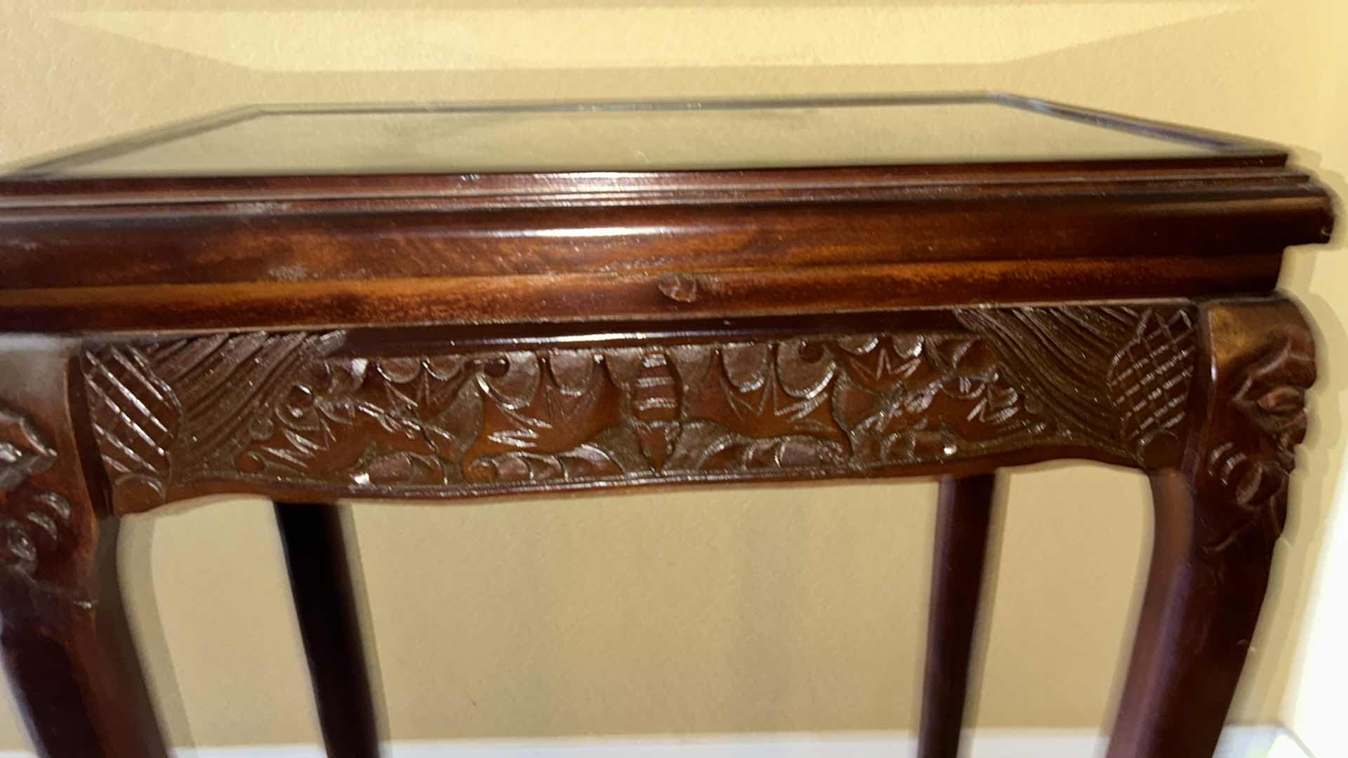 Photo 1 of CARVED WOOD TABLE WITH GLASS TOP, 19” x 12” H27”