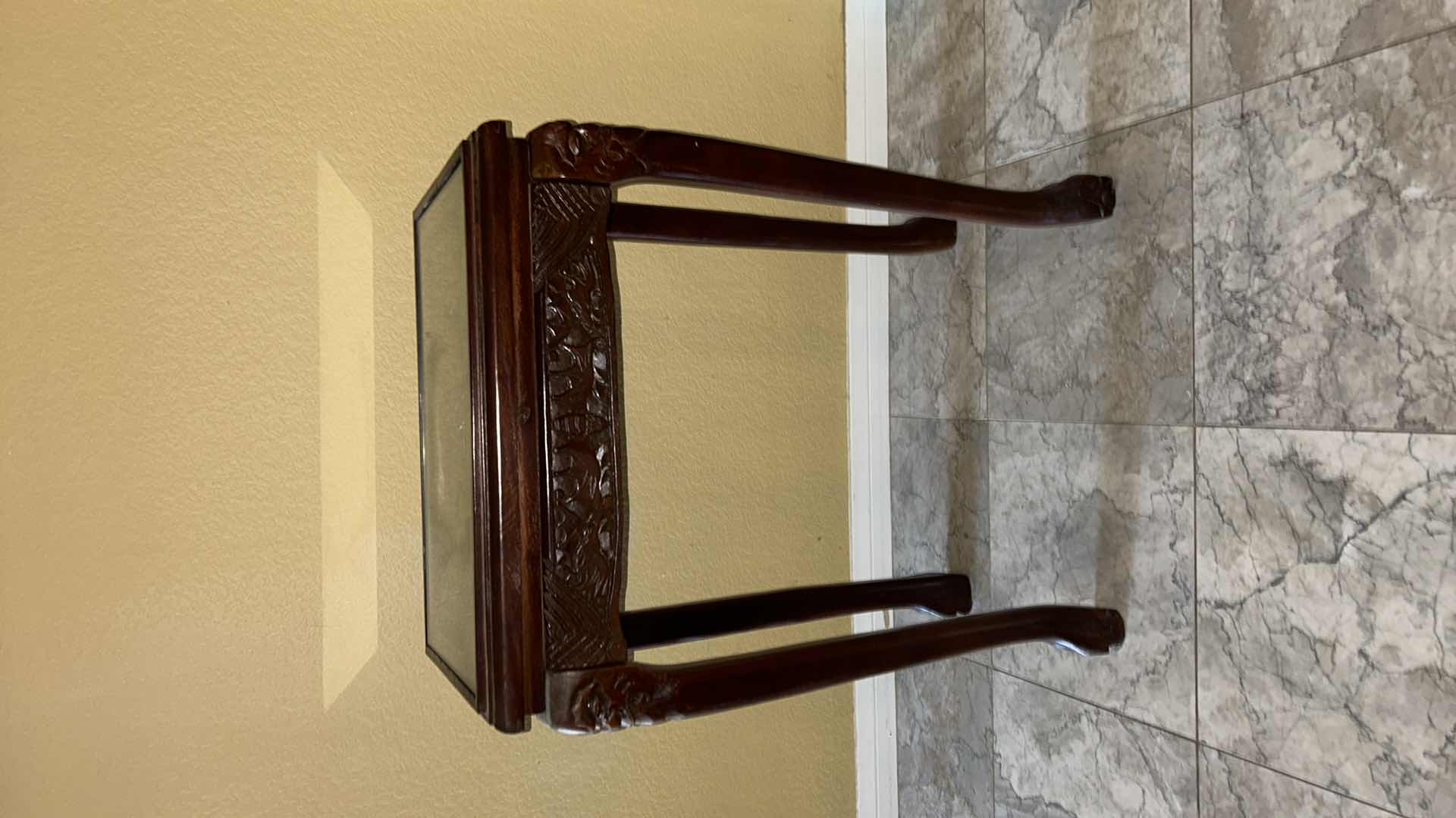 Photo 1 of CARVED WOOD TABLE WITH GLASS TOP, 19” x 12” H27”