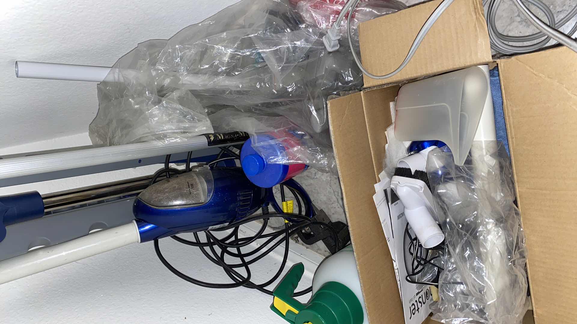 Photo 1 of FLOOR OF ENTRY CLOSET-CLEANING TOOLS AND ROWENTA IRON