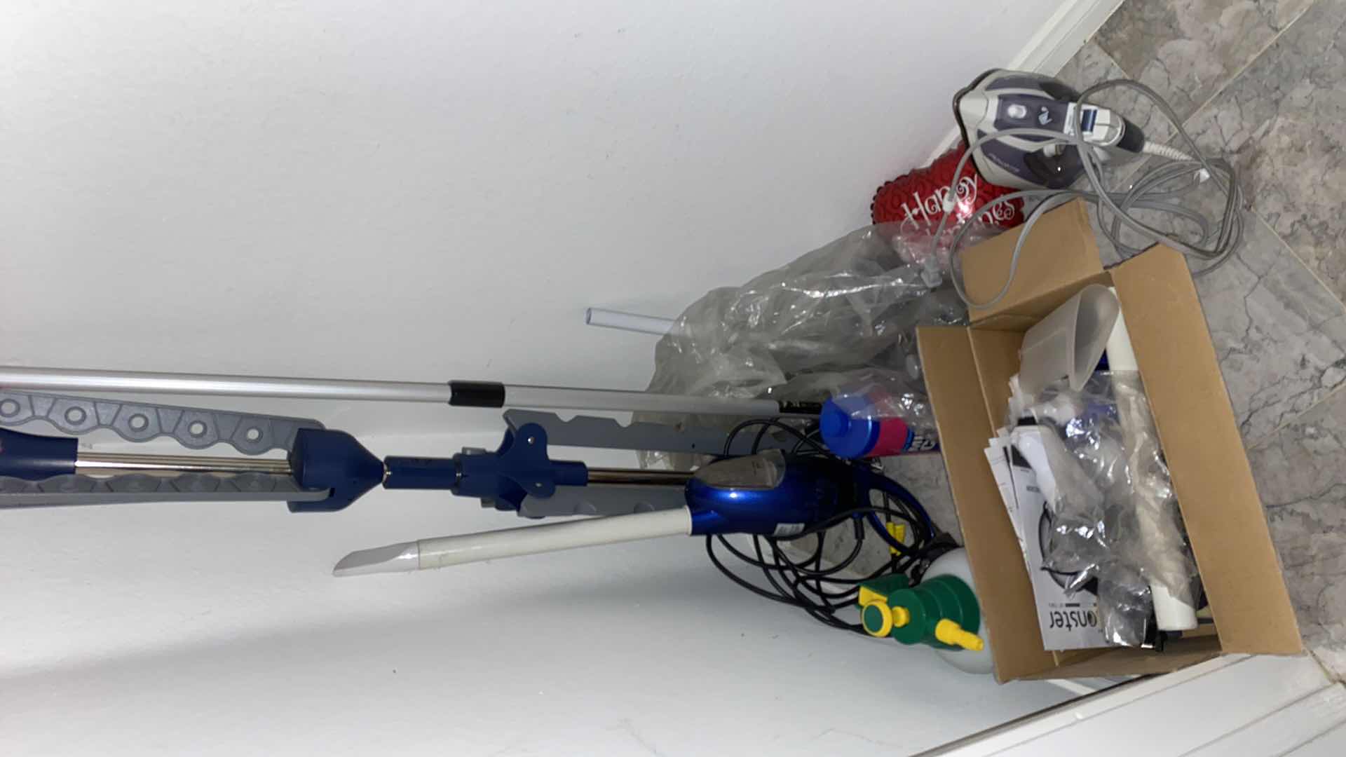 Photo 1 of FLOOR OF ENTRY CLOSET-CLEANING TOOLS AND ROWENTA IRON