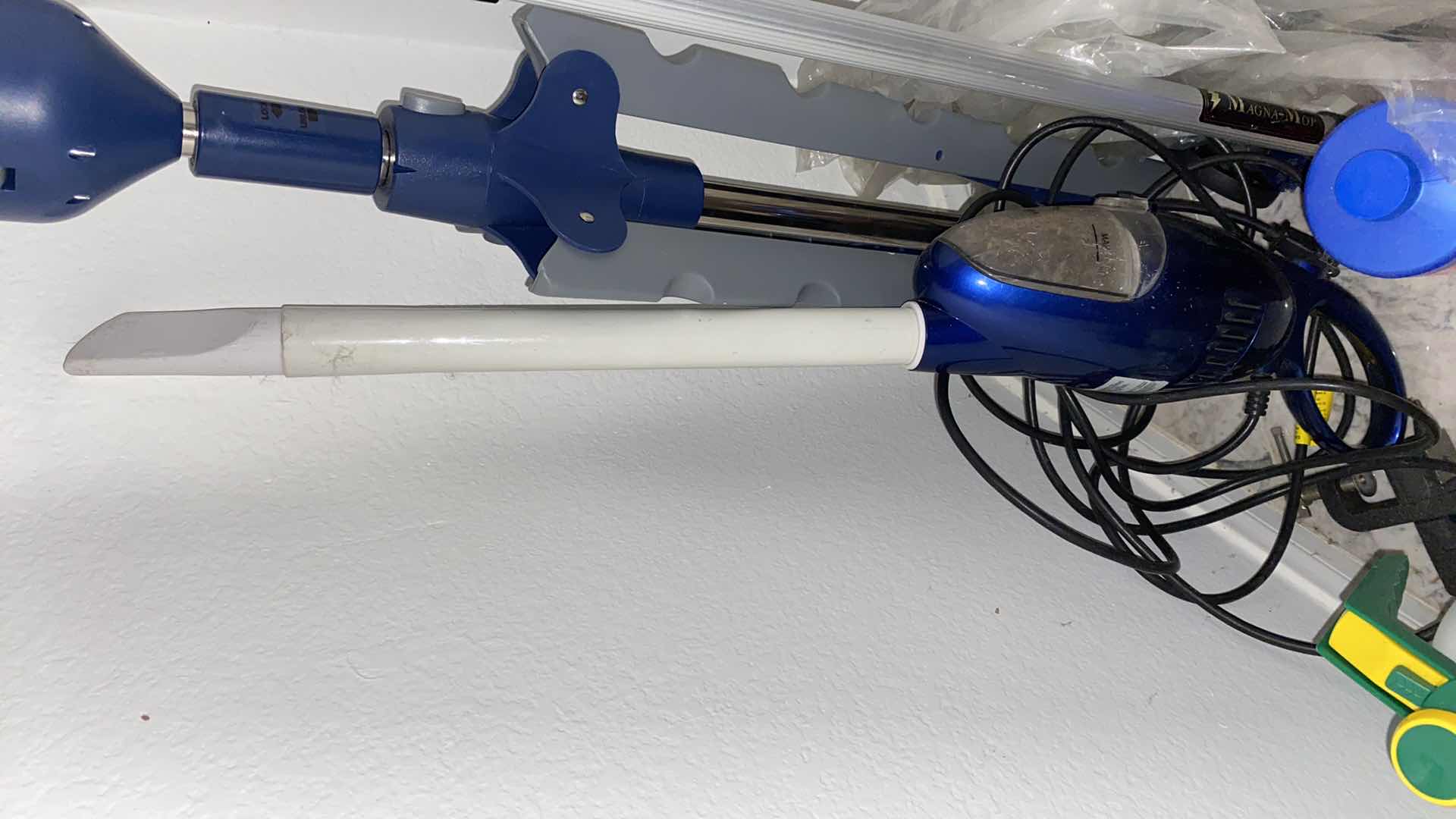 Photo 1 of FLOOR OF ENTRY CLOSET-CLEANING TOOLS AND ROWENTA IRON