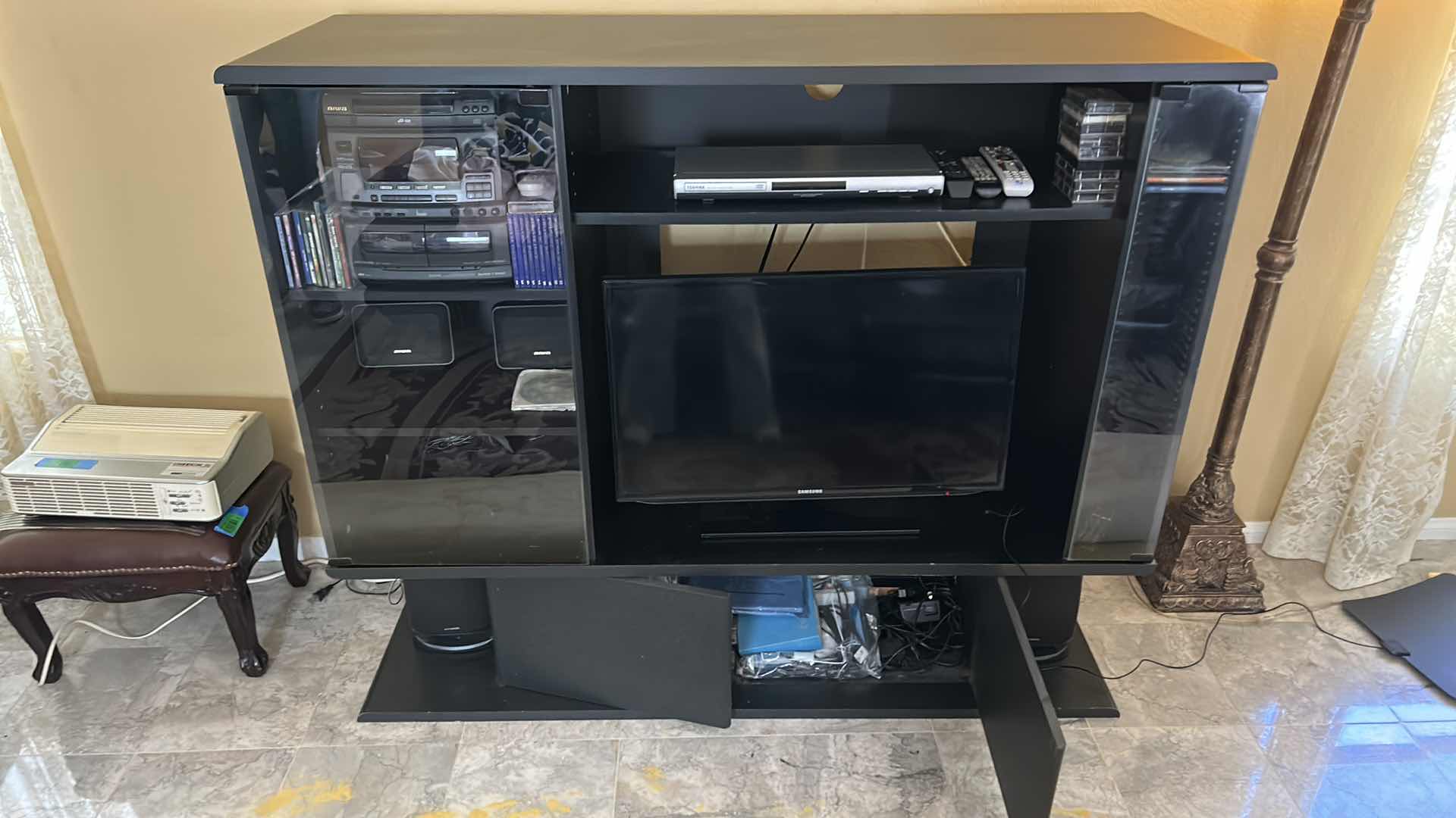 Photo 1 of BLACK ENTERTAINMENT CENTER 58” x 20” x H48” (CONTENTS NOT INCLUDED)