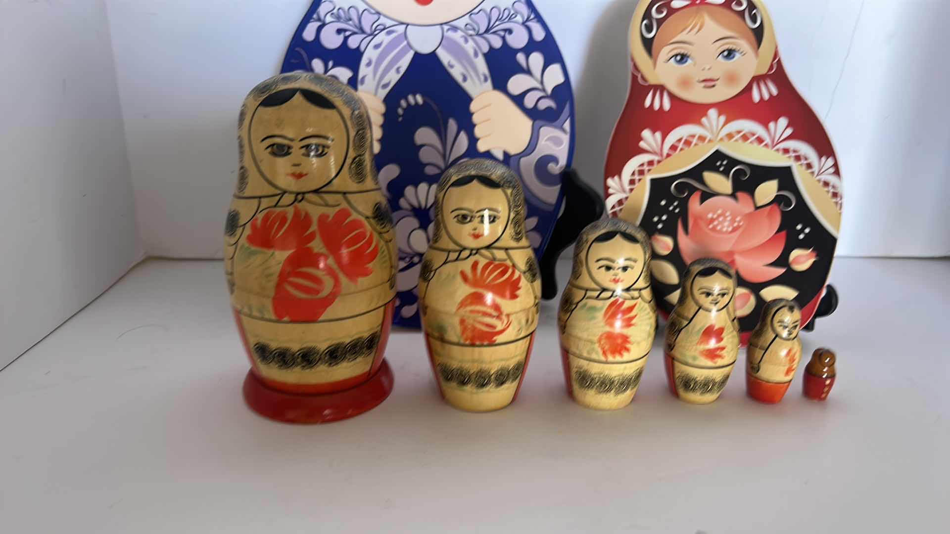 Photo 1 of RUSSIAN NESTING FOLLS AND TWO TRIVETS (STANDS NOT INCLUDED)