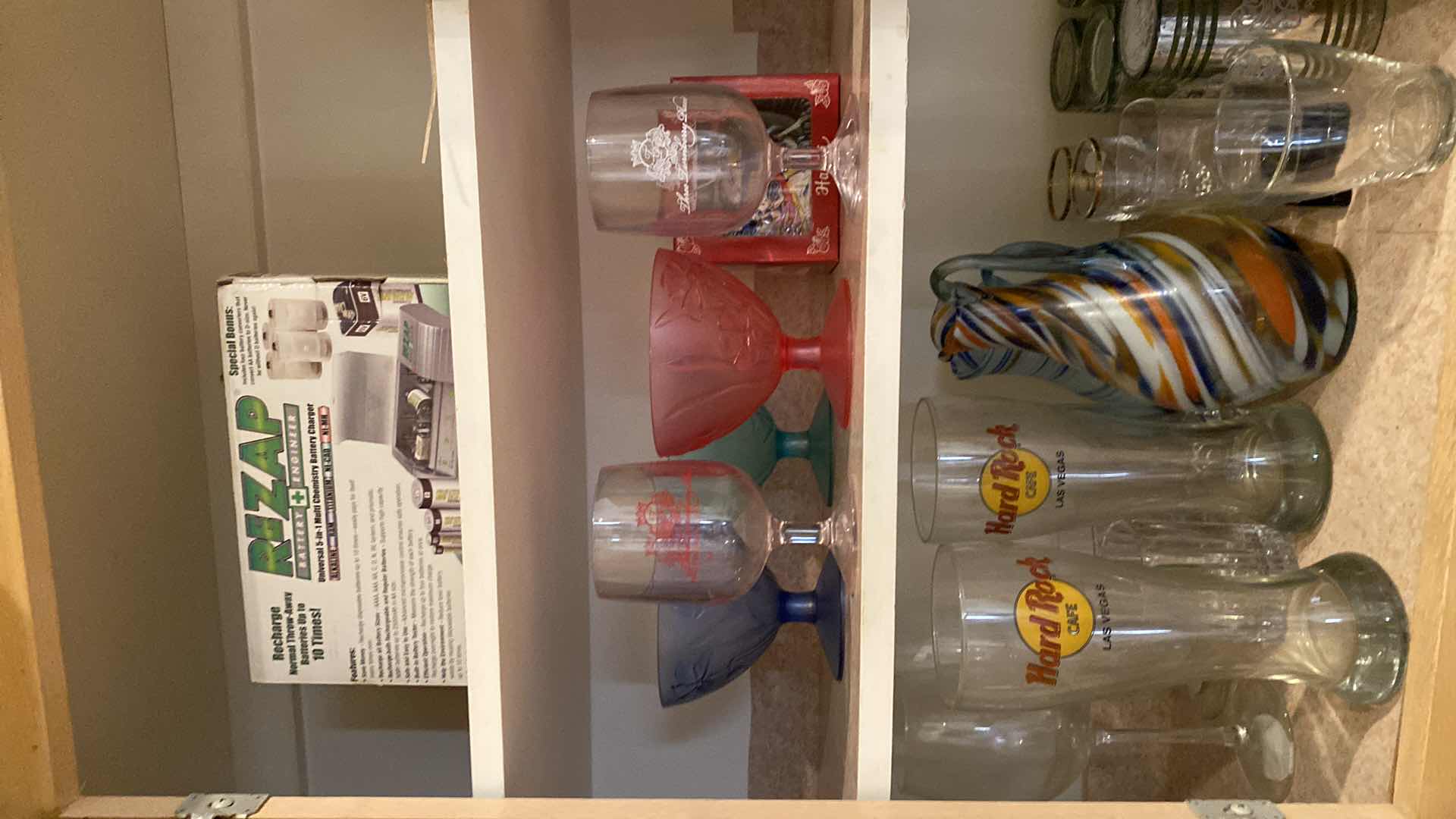 Photo 1 of CONTENTS OF KITCHEN CABINET GLASSWARE CUPS AND MORE