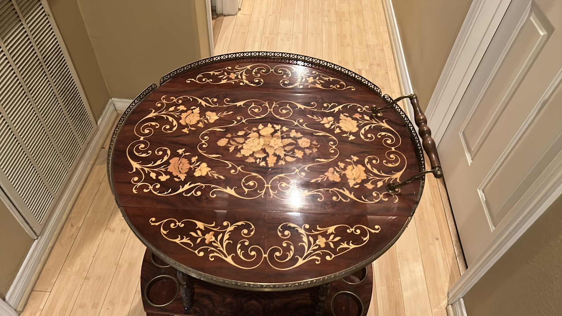 Photo 1 of VINTAGE ITALIAN SORRENTO WOOD DROP LEAF TABLE WITH INLAID COCKTAIL CART TABLE OPENED 30” ROUND CLOSED 30” x 17.5” x H27”
TABLETOP NEEDS GLUE)