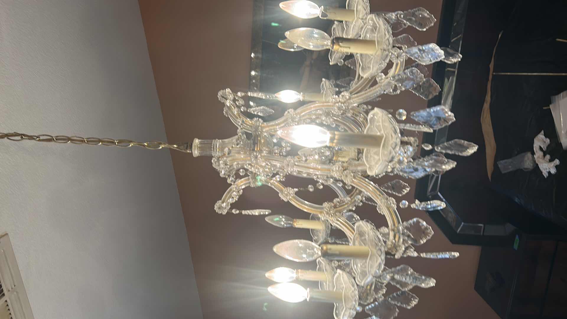 Photo 1 of VINTAGE CRYSTAL CHANDELIER W EXTRA CRYSTALS 28” x 21” (MEASUREMENT WITHOUT CHAIN)