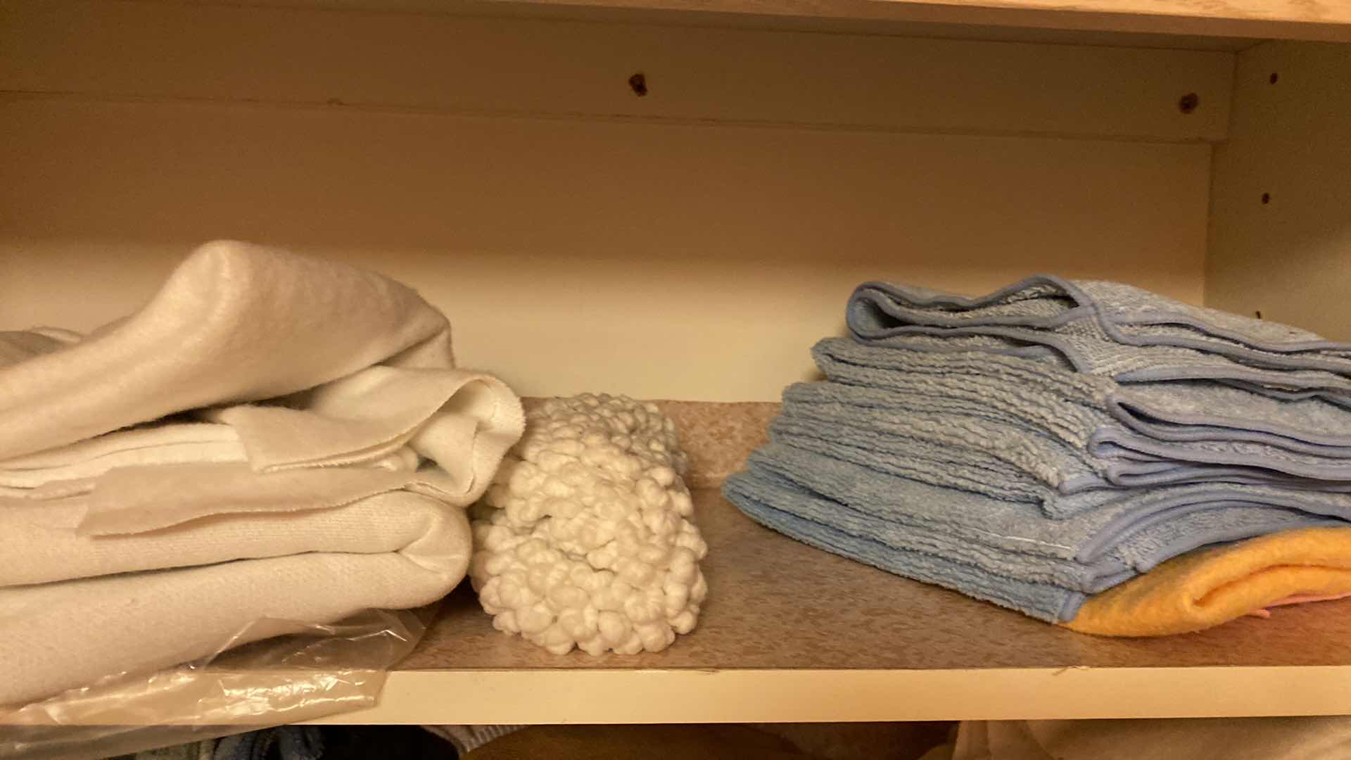 Photo 1 of CONTENTS OF  LAUNDRY ROOM CABINET CLOTHS