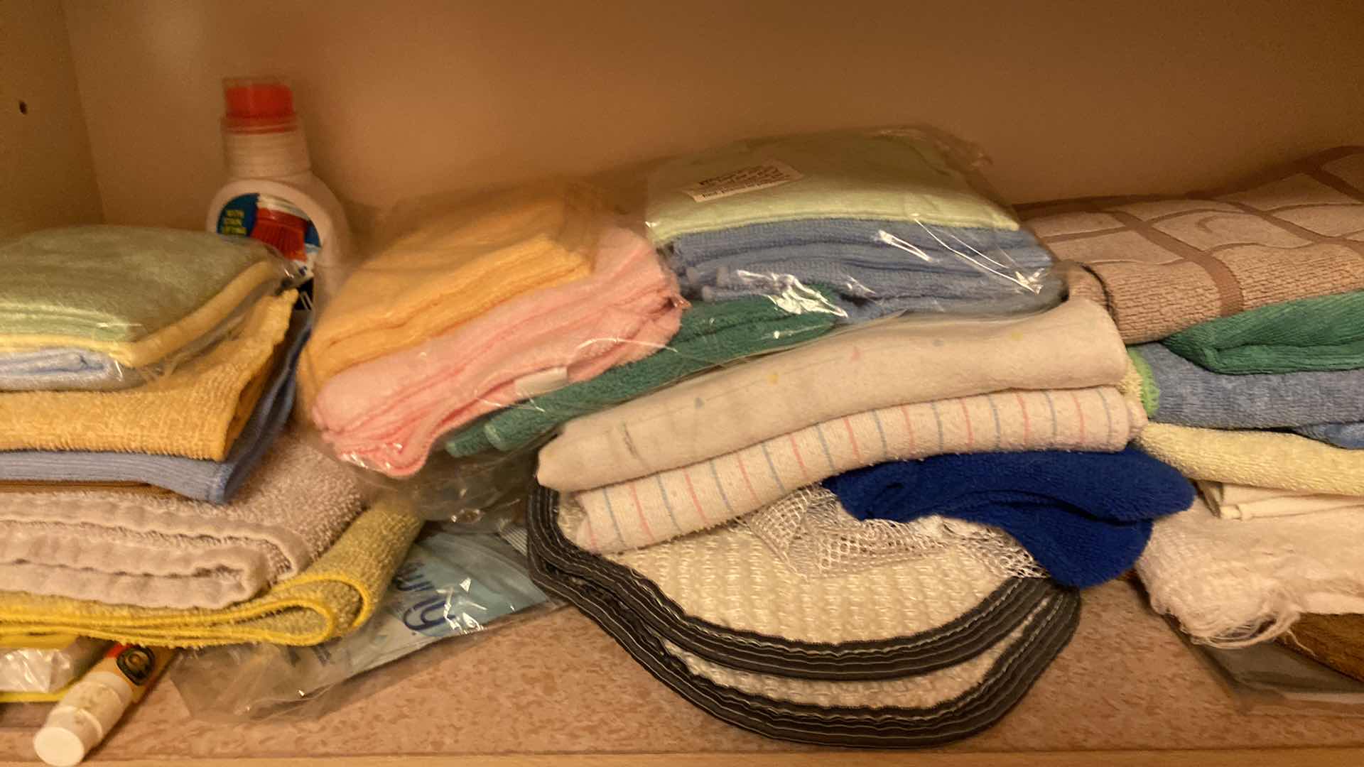 Photo 1 of CONTENTS OF  LAUNDRY ROOM CABINET CLOTHS