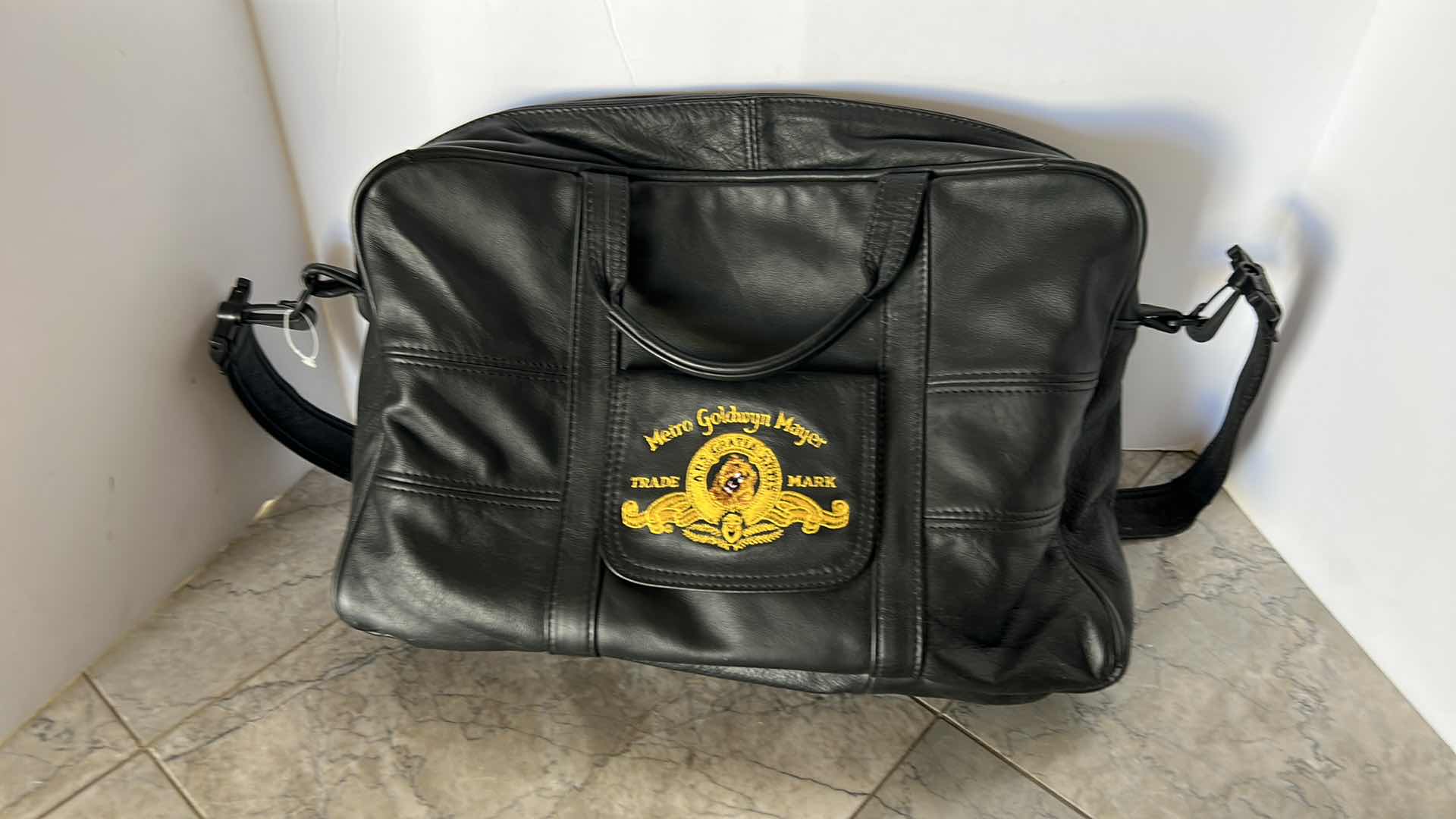 Photo 1 of METRO GOLDWYN MAYER EMBROIDERED GENUINE LEATHER TRAVEL BAG