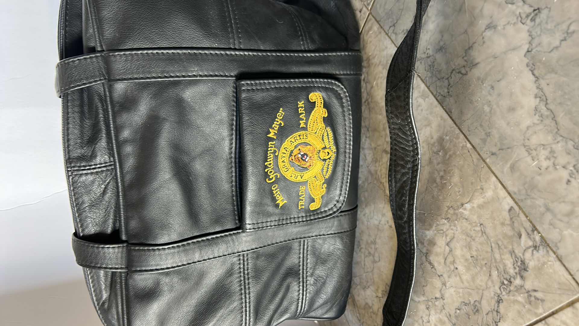 Photo 1 of METRO GOLDWYN MAYER EMBROIDERED GENUINE LEATHER TRAVEL BAG