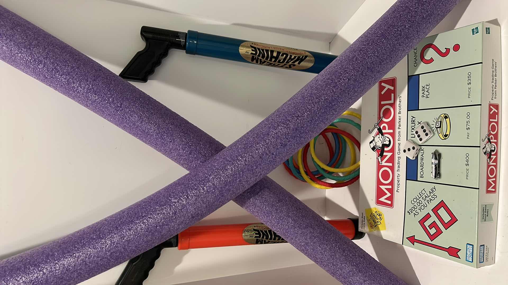 Photo 1 of POOL NOODLES/ STREAM MACHINES / RINGS / MONOPOLY