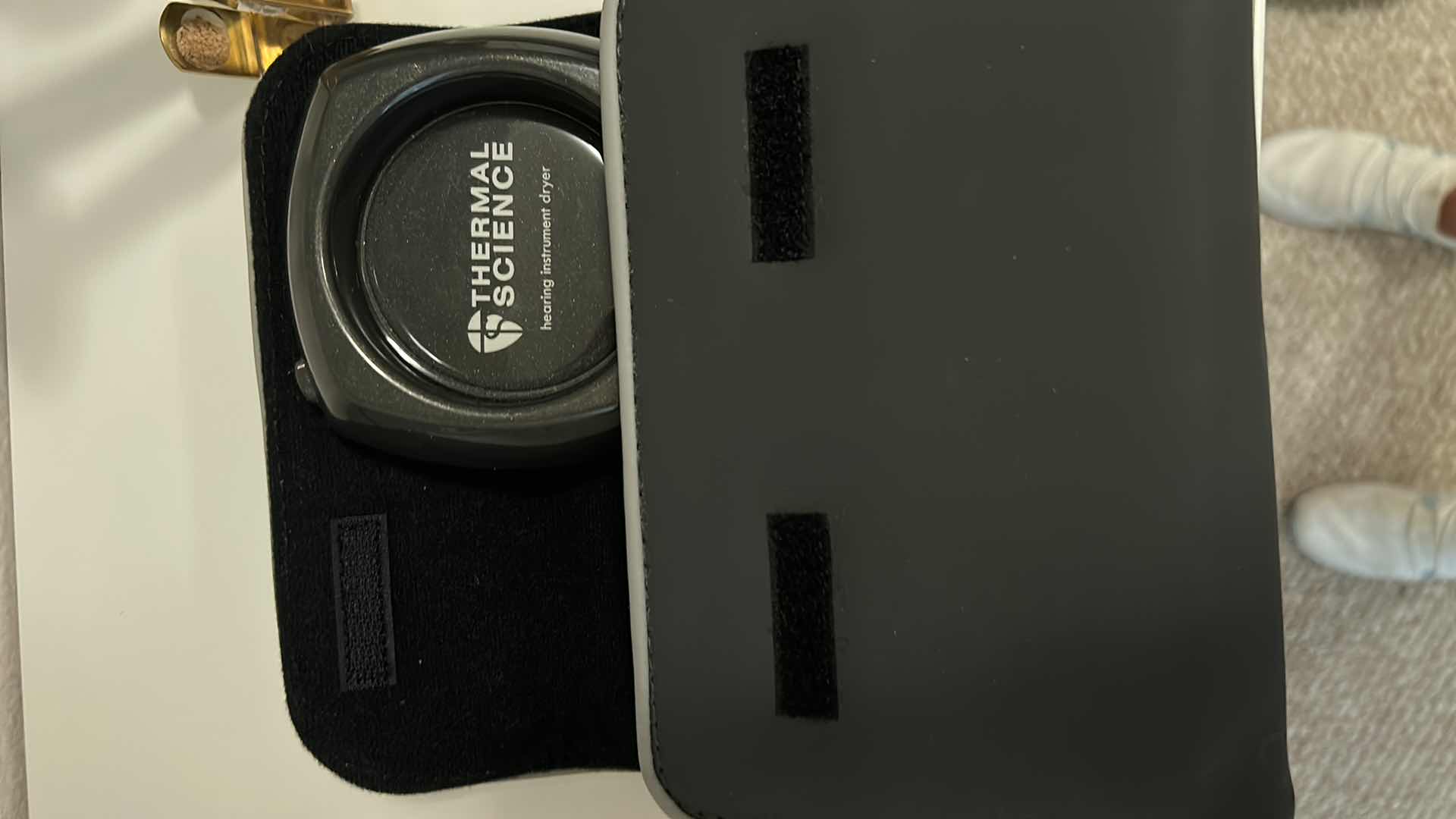 Photo 1 of CONTENTS OF SHELF (HEARING AIDS AND CLEANER NECK CUSHION ROWENTA ULTRA STEAM AND MORE)