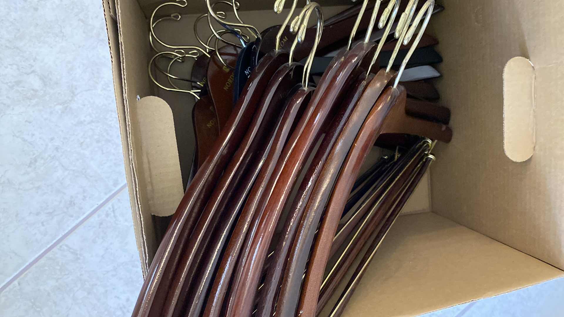 Photo 1 of BOX OF 21 WOODEN HANGERS